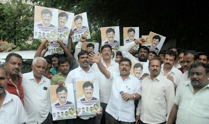 Supporters of congress leader D K Shivakumar protest infront of DH Shivakumar residence on Thursday in Bengaluru.