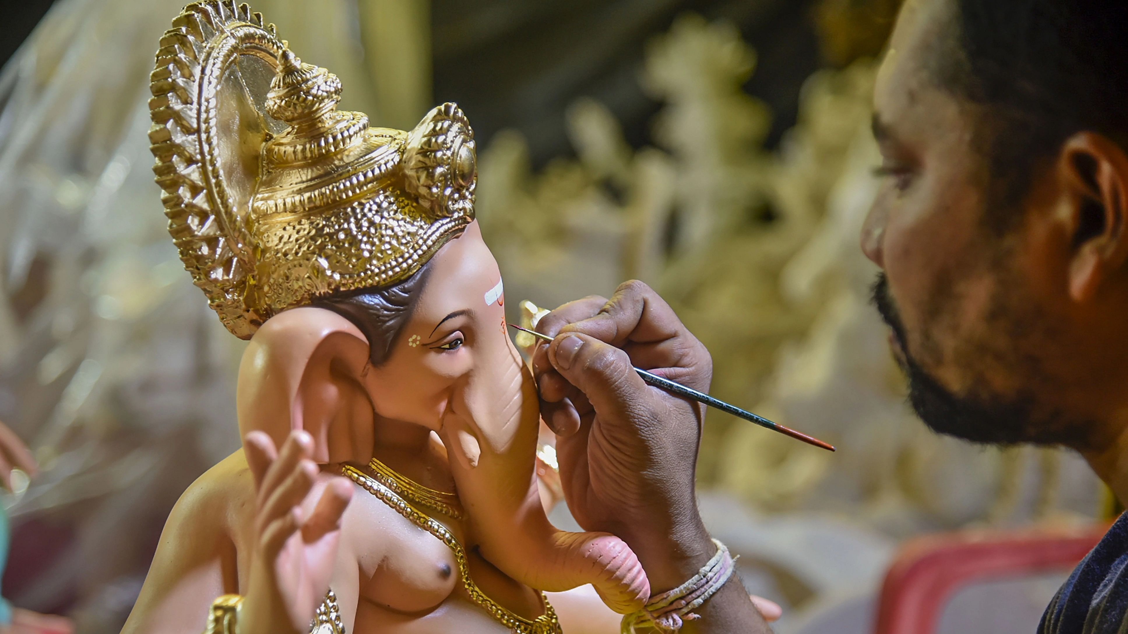 <div class="paragraphs"><p>An artist gives final touches to an idol of Lord Ganesha ahead of Ganesh Chaturthi festival.&nbsp;</p></div>