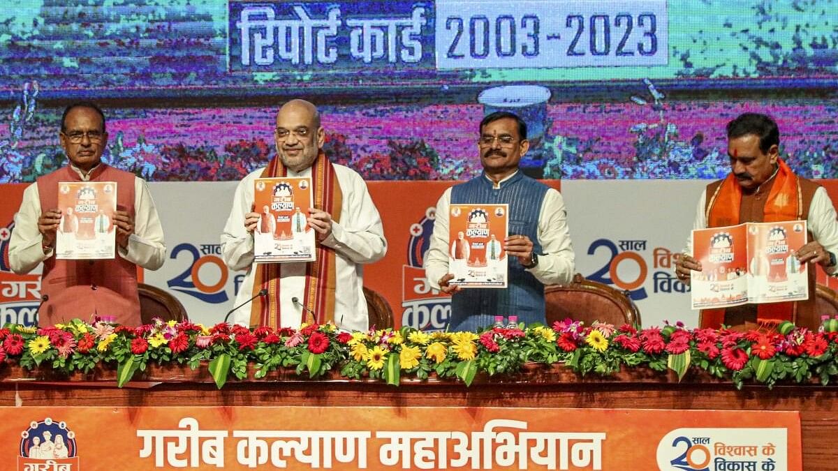 <div class="paragraphs"><p>Union Home Minister Amit Shah with Madhya Pradesh Chief Minister Shivraj Singh Chouhan during the launch of the 'Garib Kalyan Maha Abhiyan' along with the report card of the 20 years of the BJP government in the state, in Bhopal, Sunday, Aug. 20, 2023.</p></div>