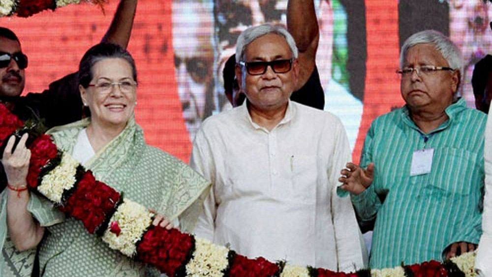 <div class="paragraphs"><p>Sonia Gandhi with Nitish Kumar and Lalu Prasad.</p></div>