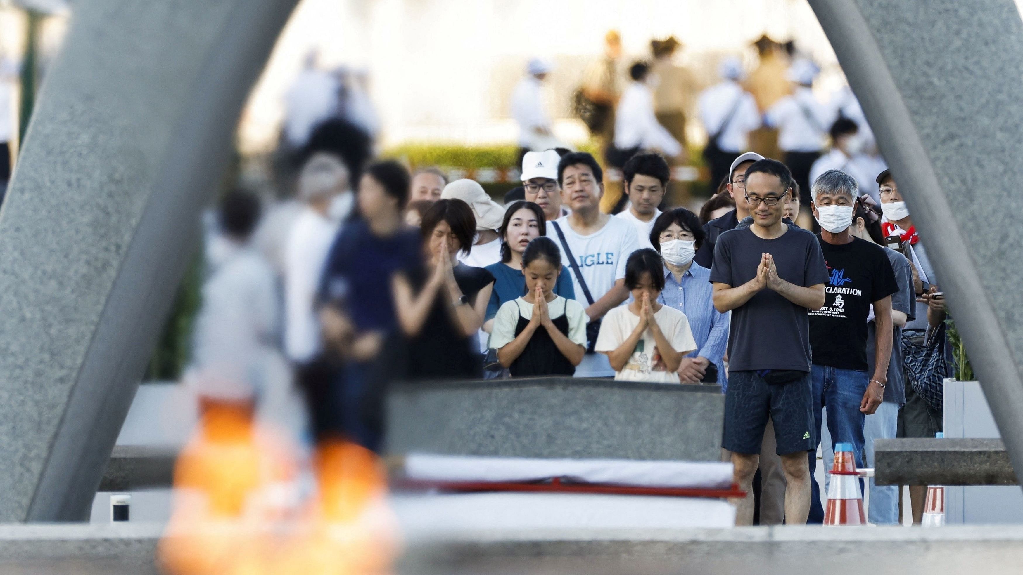 <div class="paragraphs"><p>People pray in front of the cenotaph for the victims of the 1945 atomic bombing, on the anniversary of the world's first atomic bombing, at Peace Memorial Park in Hiroshima, western Japan, in this photo taken by Kyodo on August 6, 2023.</p></div>