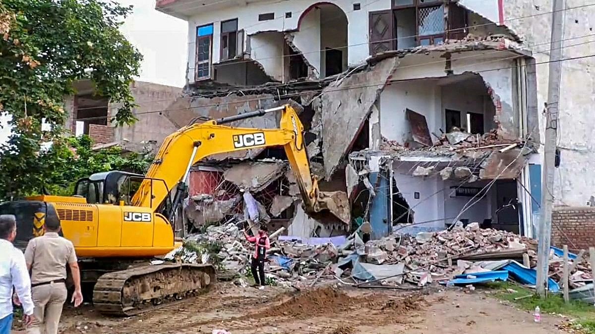 <div class="paragraphs"><p>Bulldozer being used to demolish the 'illegally constructed' Sahara hotel in violence-hit Nuh district.</p></div>