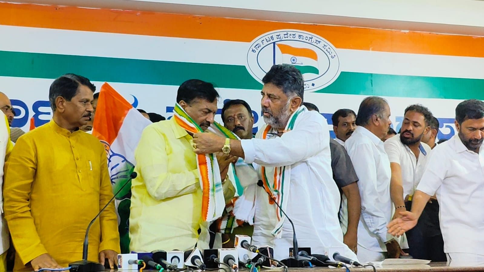 Karnataka Pradesh Congress Committee president D K Shivakumar welcomes former MP Ayanur Manjunath into the Congress at a programme at the KPCC office in Bengaluru on Thursday. 