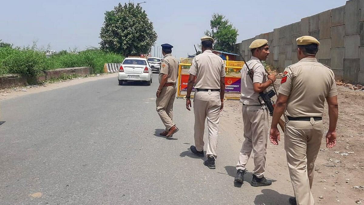 <div class="paragraphs"><p>Police personnel keep vigil on the eve of 'Brij Mandal Yatra' that will be taken out in Nuh by VHP, in Faridabad, Sunday, Aug 27, 2023.</p></div>