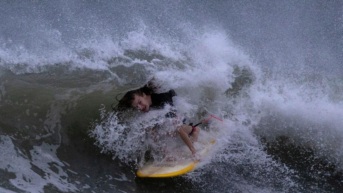 <div class="paragraphs"><p>A surfer rides the swells ahead of Hurricane Idalia in Clearwater Beach, Florida, US, August 29, 2023.</p></div>
