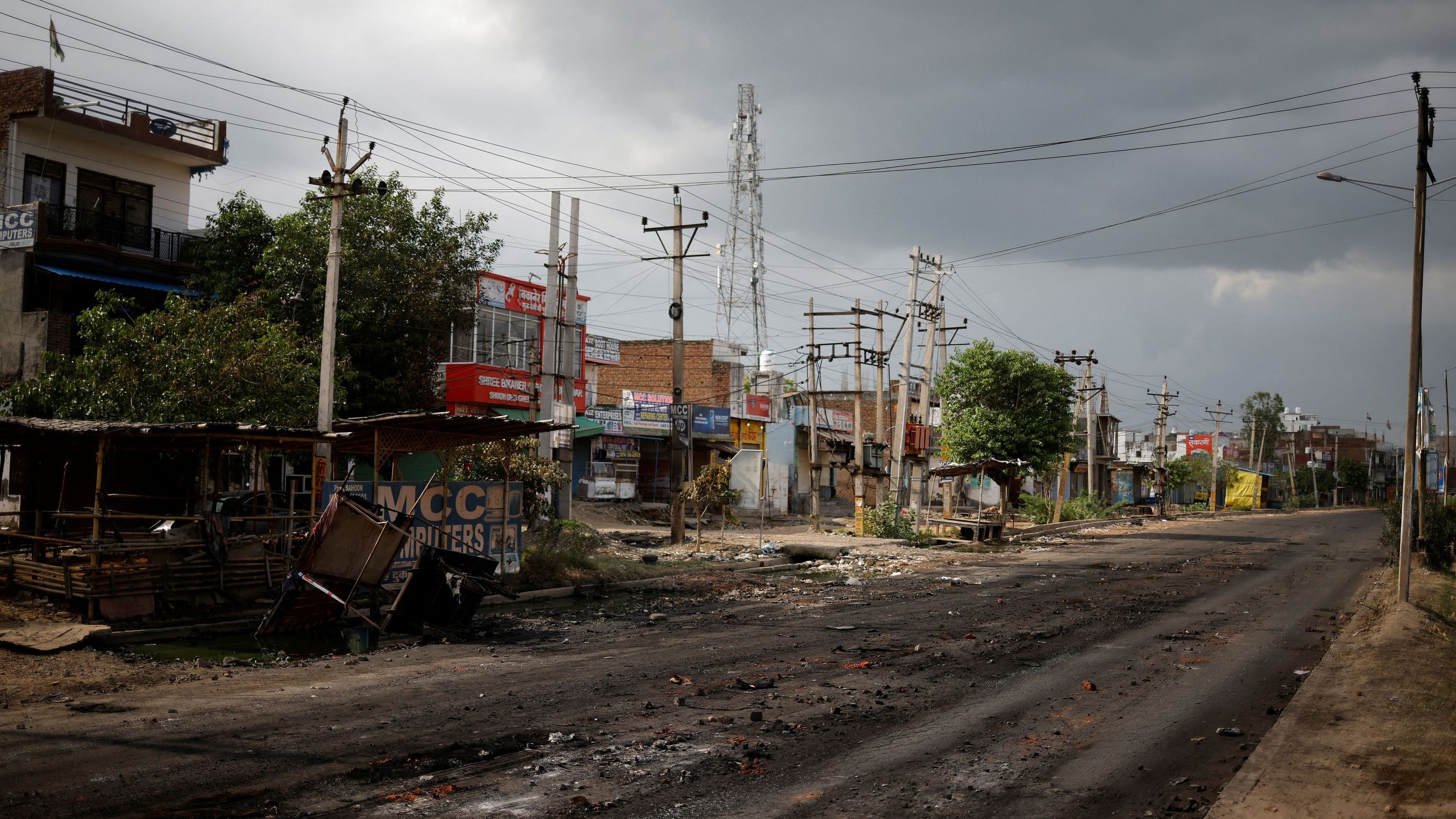 <div class="paragraphs"><p>A burnt shop is seen next to a deserted road during a curfew imposed by the authorities following clashes between Hindus and Muslims in Nuh district of the northern state of Haryana, India, August 1, 2023.</p></div>