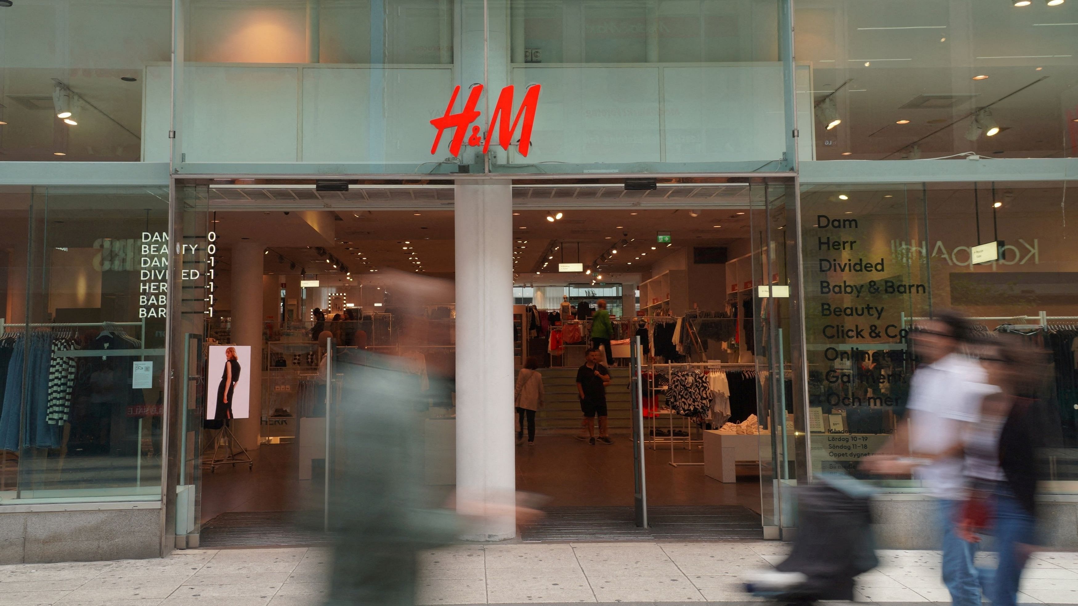 <div class="paragraphs"><p> Pedestrians and shoppers walk past a branch of fashion retailer H&amp;M in central Stockholm, Sweden, July 17, 2023. </p></div>