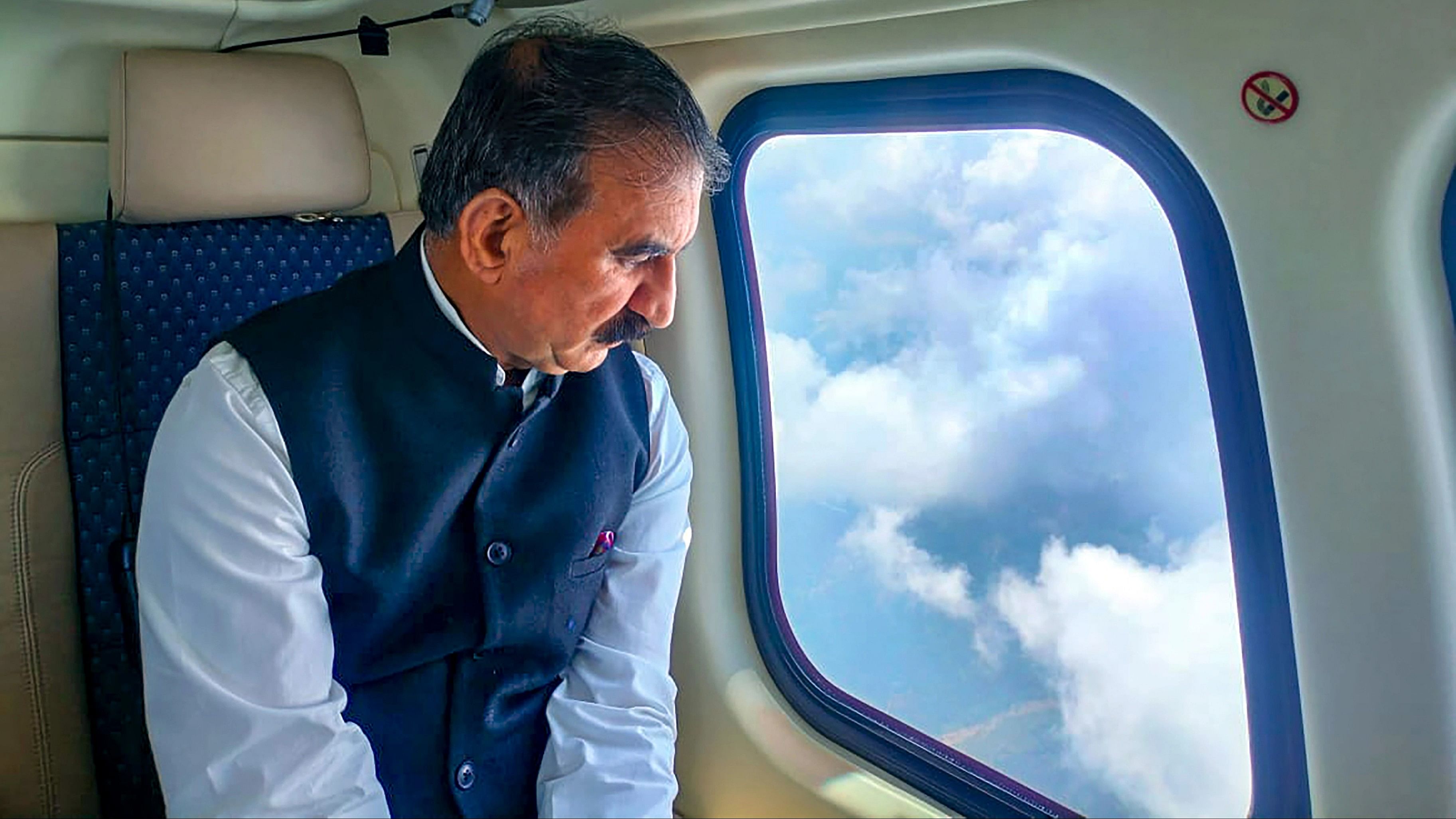 <div class="paragraphs"><p>Himachal Pradesh Chief Minister Sukhvinder Singh Sukhu conducts an aerial survey to take stock of the situation following incessant monsoon rains, in Kangra district, Wednesday, August 16, 2023. </p></div>