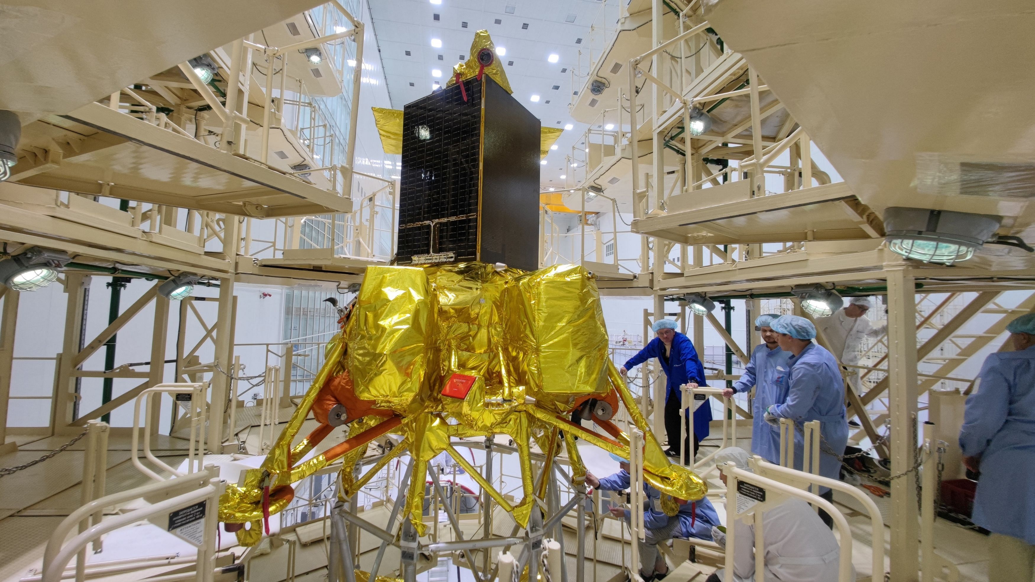 <div class="paragraphs"><p>Specialists take part in preparations ahead of the launch of the lunar landing spacecraft Luna-25 mission to search for ice near the south pole of the moon, at the Vostochny Cosmodrome in the Amur region, Russia, in this handout photo published August 1, 2023. </p></div>