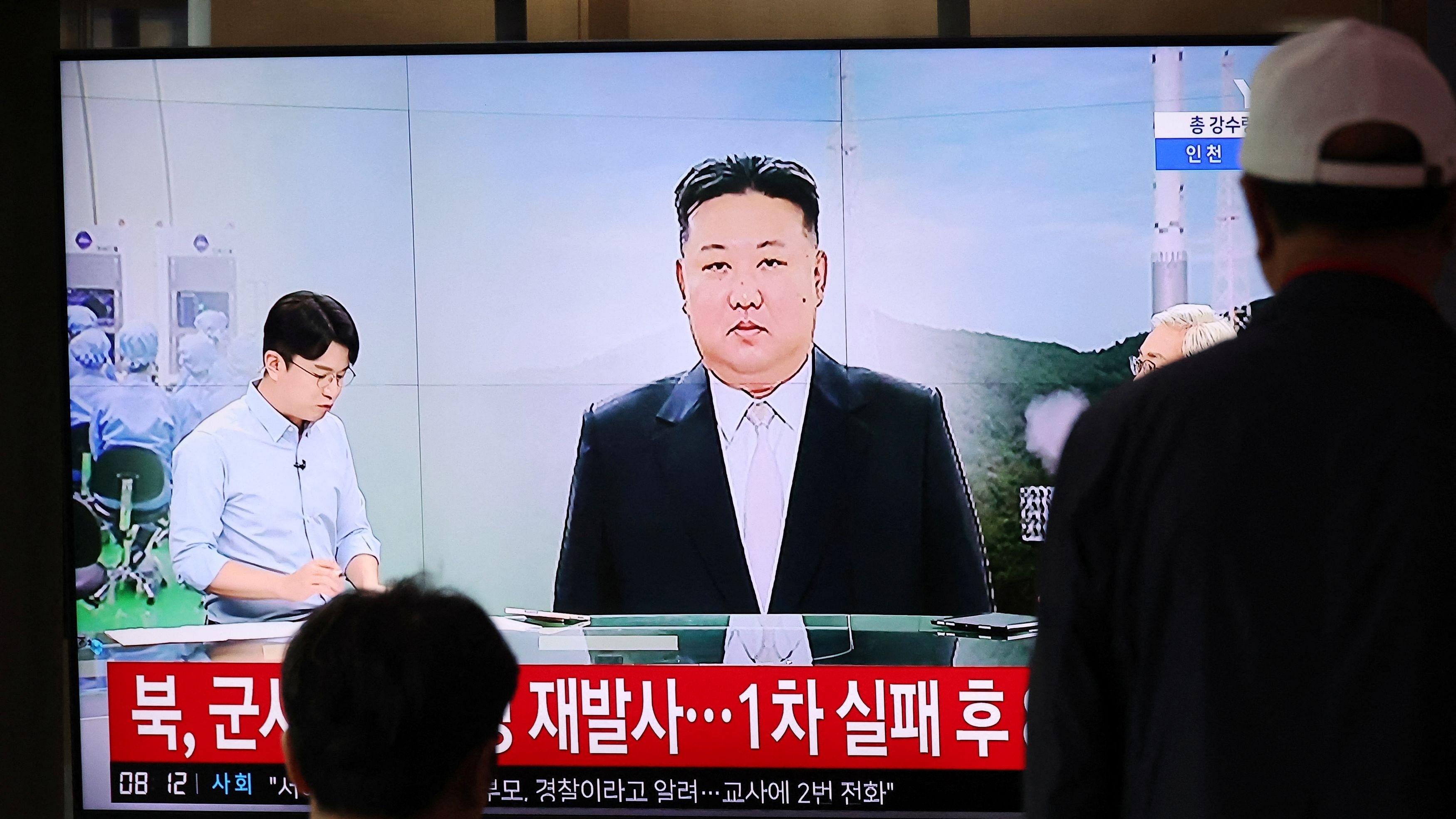 <div class="paragraphs"><p>Passengers watch a TV broadcasting a news report on North Korea firing a space rocket, at a railway station in Seoul, South Korea, August 24, 2023.</p></div>