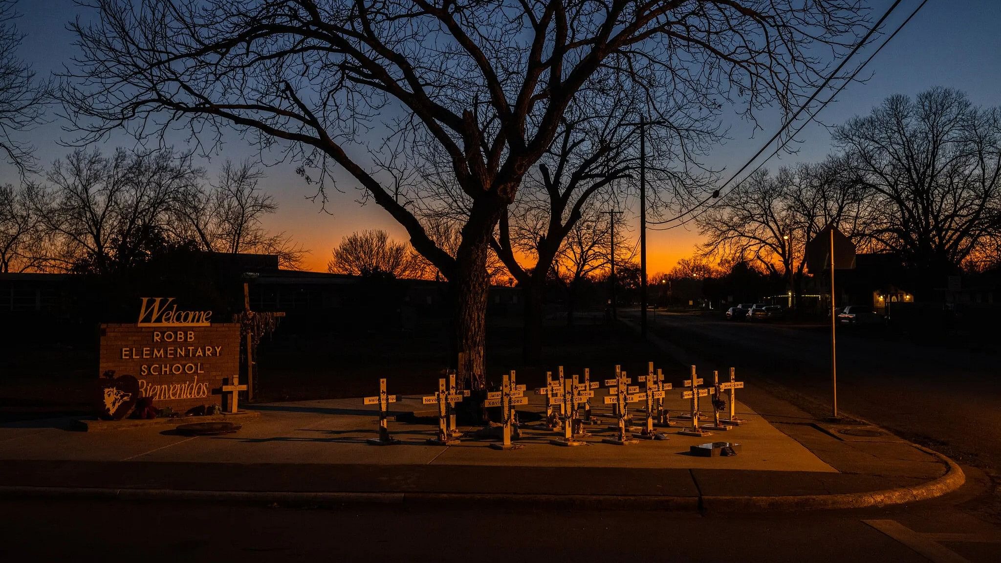 <div class="paragraphs"><p>Crosses honoring the 19 children and two teachers killed in the 2022 shooting at Robb Elementary School in Uvalde, Texas, on a newly paved area outside of the school.</p></div>