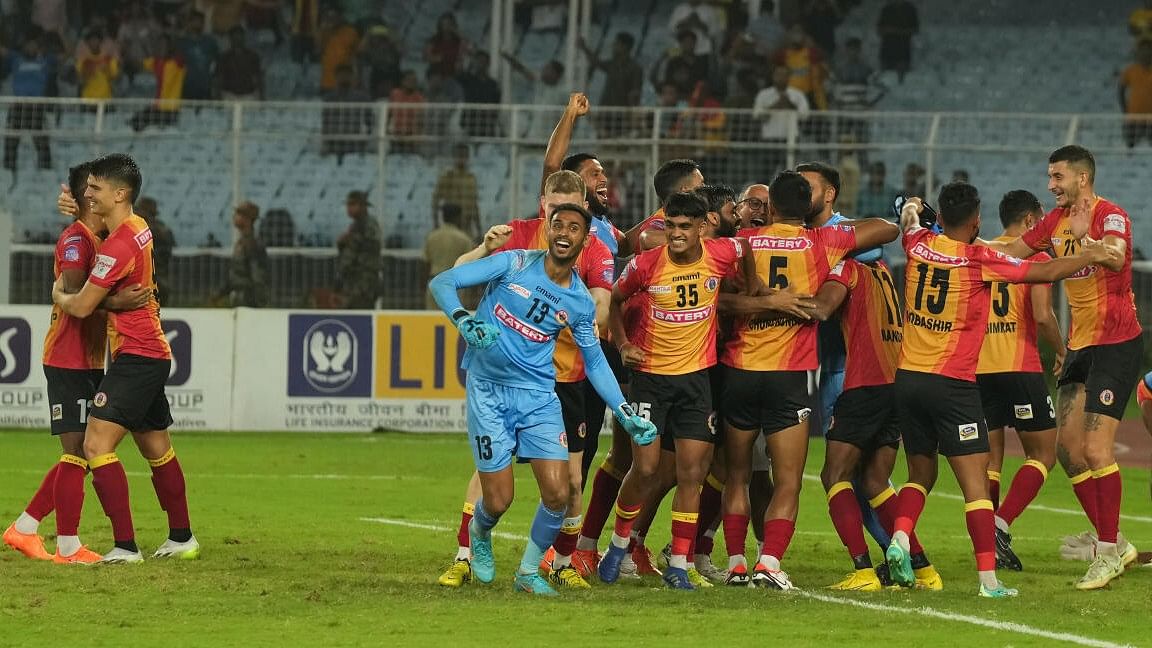 <div class="paragraphs"><p>East Bengal FC goal keeper Prabhsukhan Singh Gill (13) with his teammates celebrates after their win against North East United FC in 1st semifinal match of Durand Cup.</p></div>