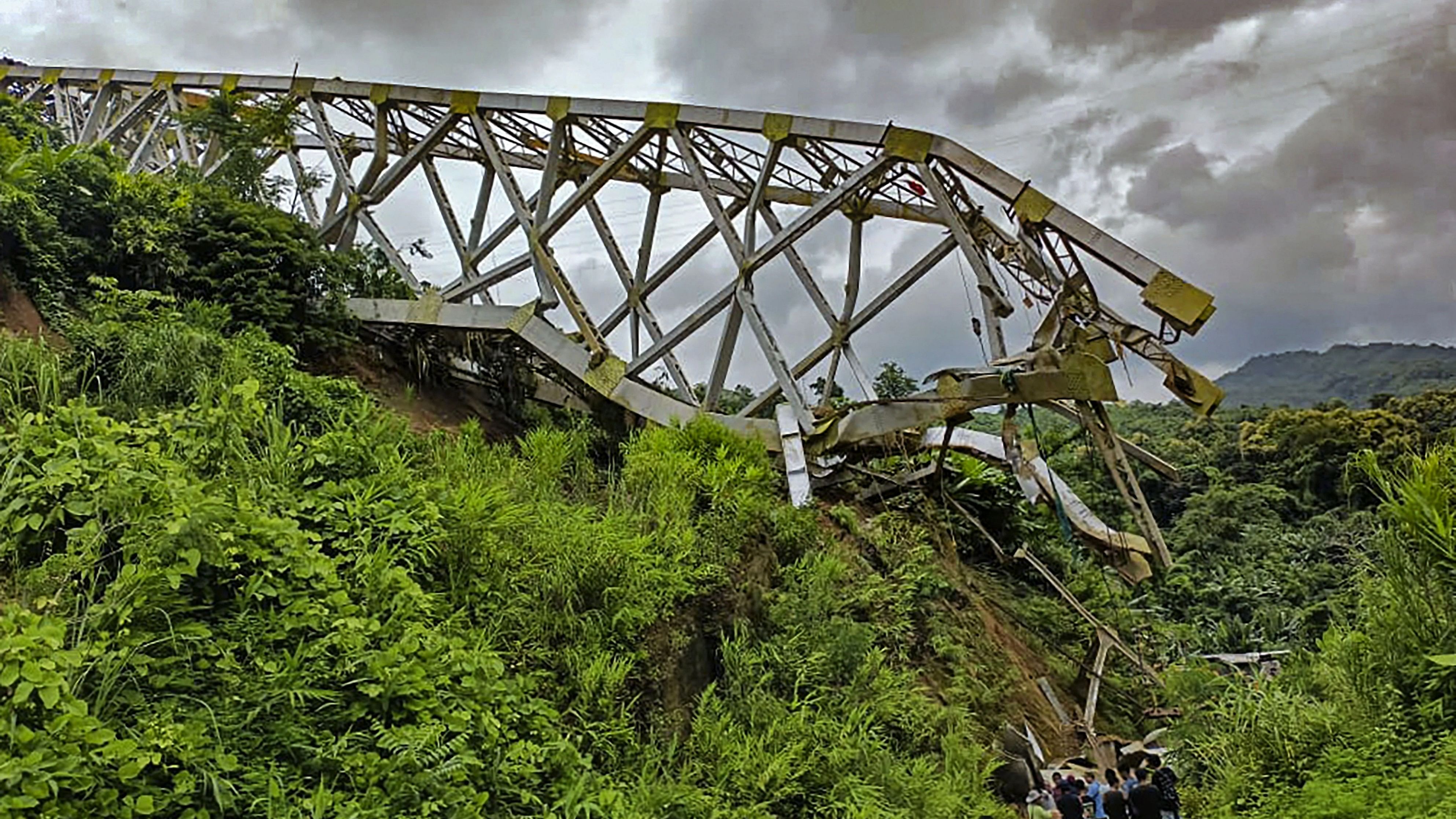 <div class="paragraphs"><p>Locals at the site after an under-construction railway bridge at Sairang area collapsed, near Aizawl, Mizoram, Wednesday, Aug. 23, 2023. </p></div>