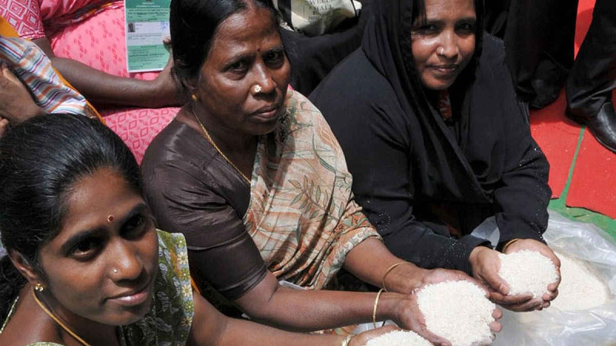 <div class="paragraphs"><p>Representative image of women with rice from Anna Bhagya scheme.</p></div>