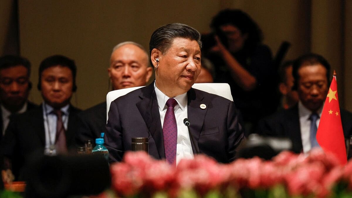 <div class="paragraphs"><p>President of China Xi Jinping looks on at the plenary session during the 2023 BRICS Summit at the Sandton Convention Centre in Johannesburg, South Africa August 23, 2023.</p></div>