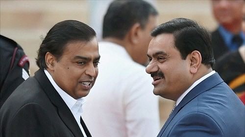 <div class="paragraphs"><p>File photo of Industrilaists Mukesh Ambani (left ) and Gautam Adani at the swearing-in ceremony of the NDA government at Rashtrapati Bhavan in New Delhi. </p></div>