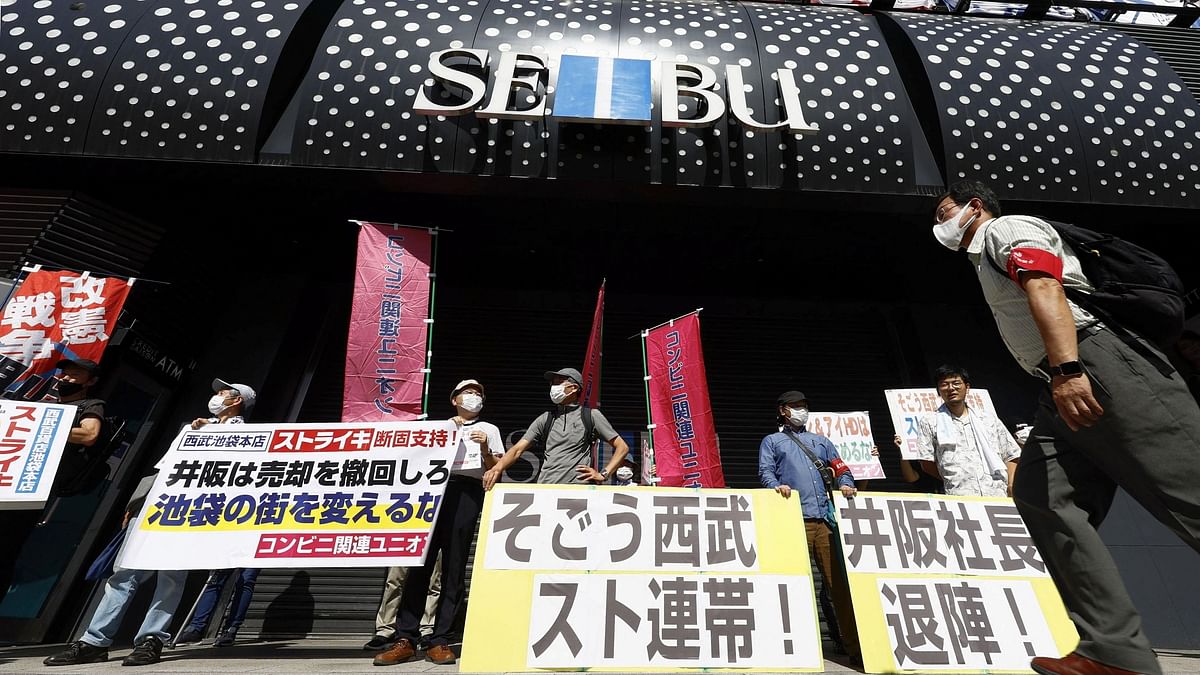 Workers stage Japan's first strike in decades over department