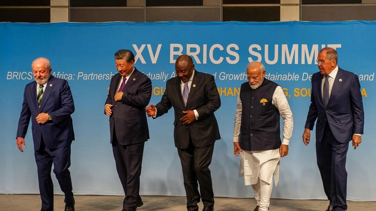 <div class="paragraphs"><p>Brazil's President Luiz Inacio Lula da Silva, China's President Xi Jinping, South African President Cyril Ramaphosa, Indian Prime Minister Narendra Modi and Russia's Foreign Minister Sergei Lavrov walk after posing for a picture at the BRICS Summit.&nbsp;</p></div>