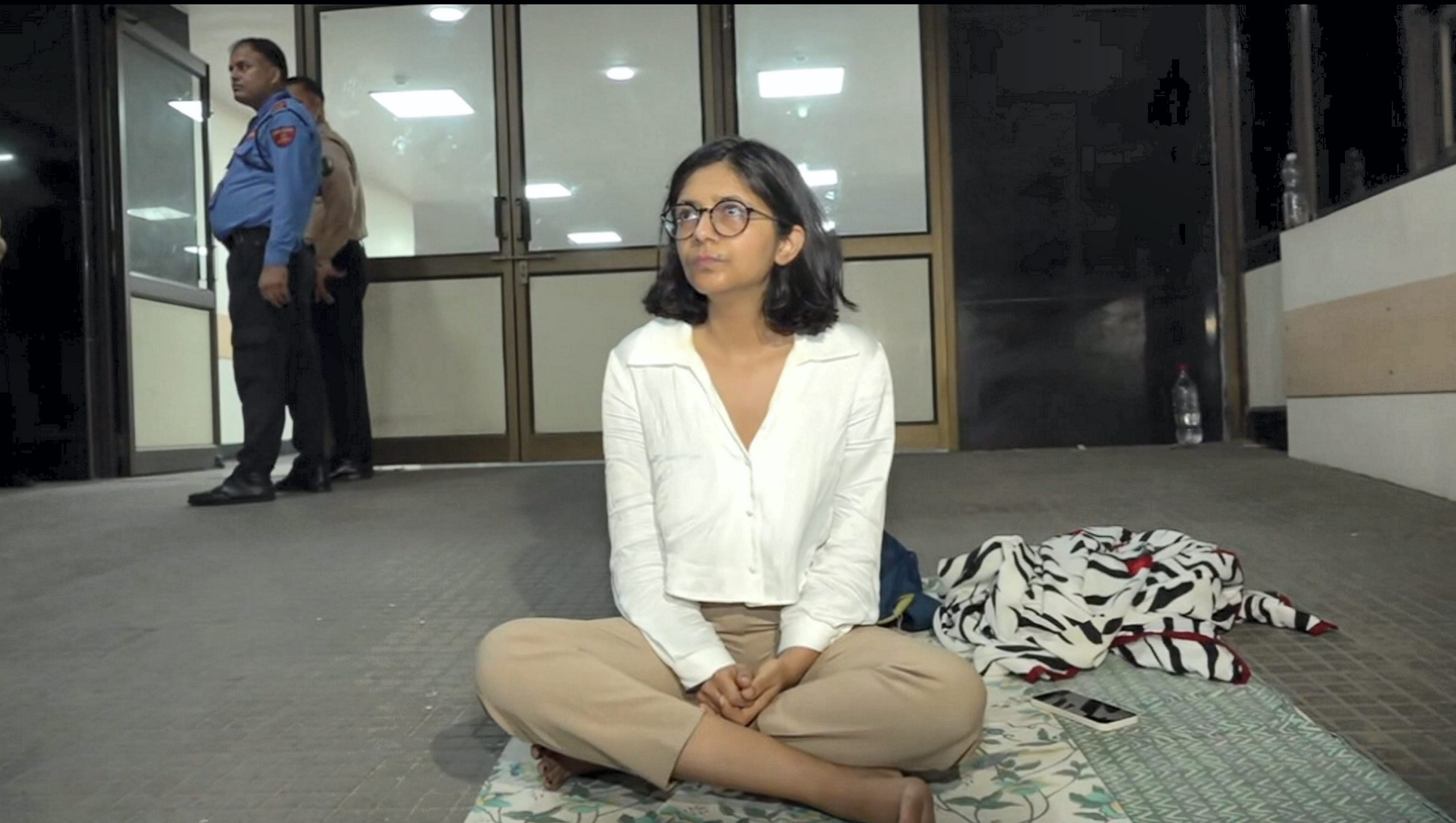 <div class="paragraphs"><p>Delhi Commission for Women (DCW) Chairperson Swati Maliwal sits outside the hospital where a minor who was allegedly raped by a Delhi government officer is admitted, in New Delhi, Monday night, Aug. 21, 2023. Maliwal staged a protest outside the hospital alleging that the authorities did not allow her to meet the survivor. </p></div>