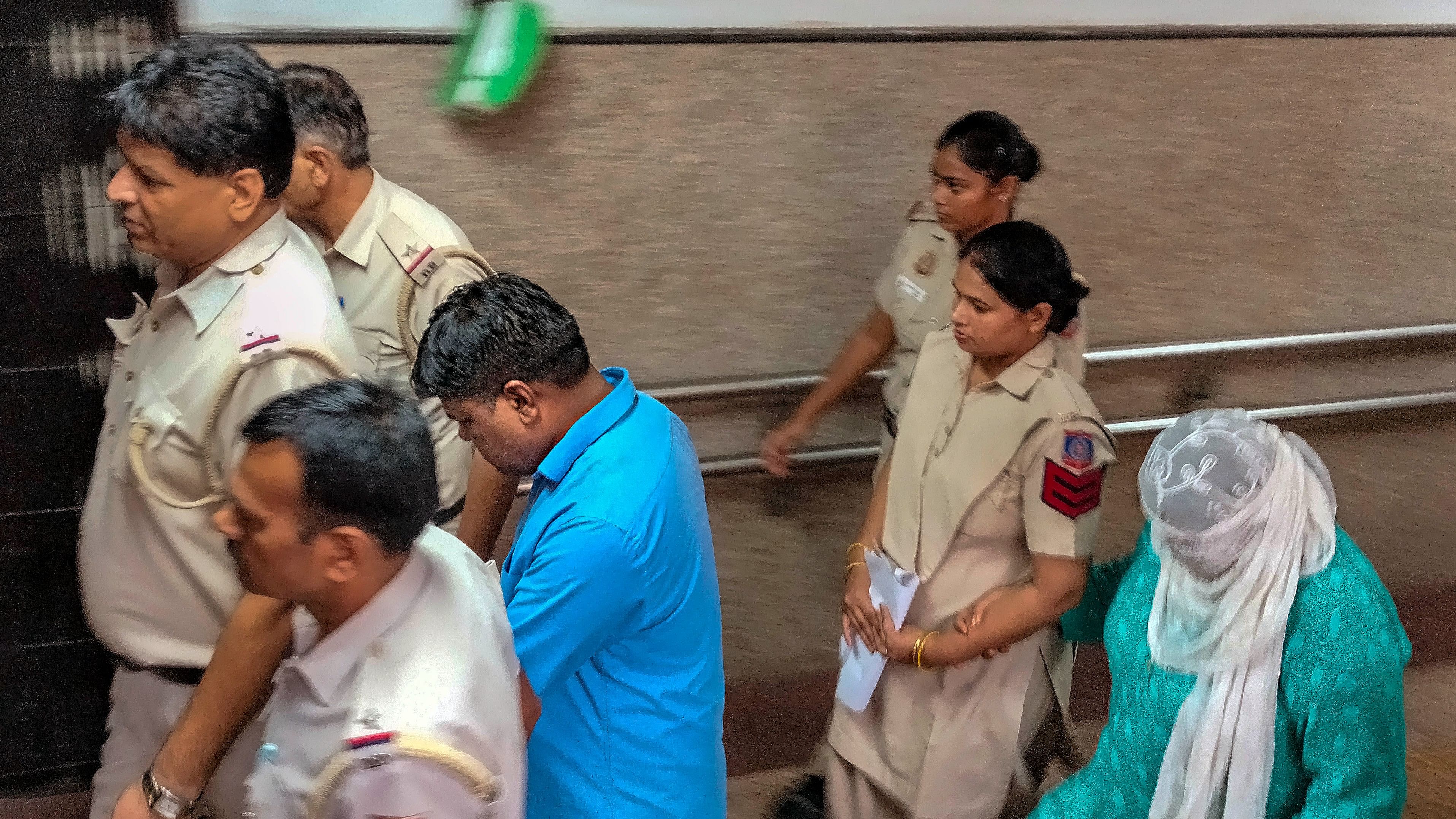 <div class="paragraphs"><p>Suspended Delhi officer and his wife, accused of repeatedly raping a minor, being produced at the Tis Hazari court, in New Delhi, Wednesday, Aug 23, 2023.</p></div>