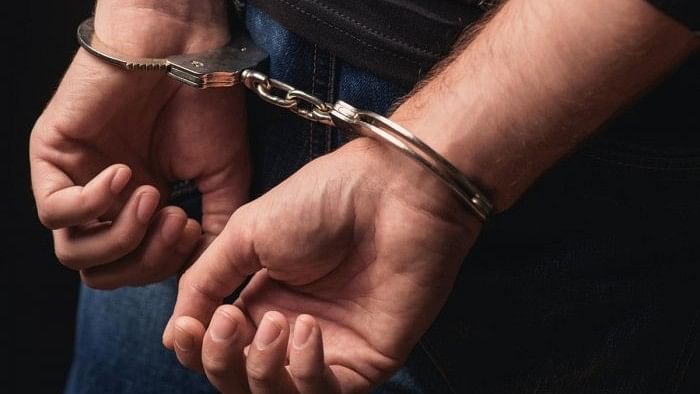 <div class="paragraphs"><p>Representative image of a man in handcuffs, being arrested.</p></div>