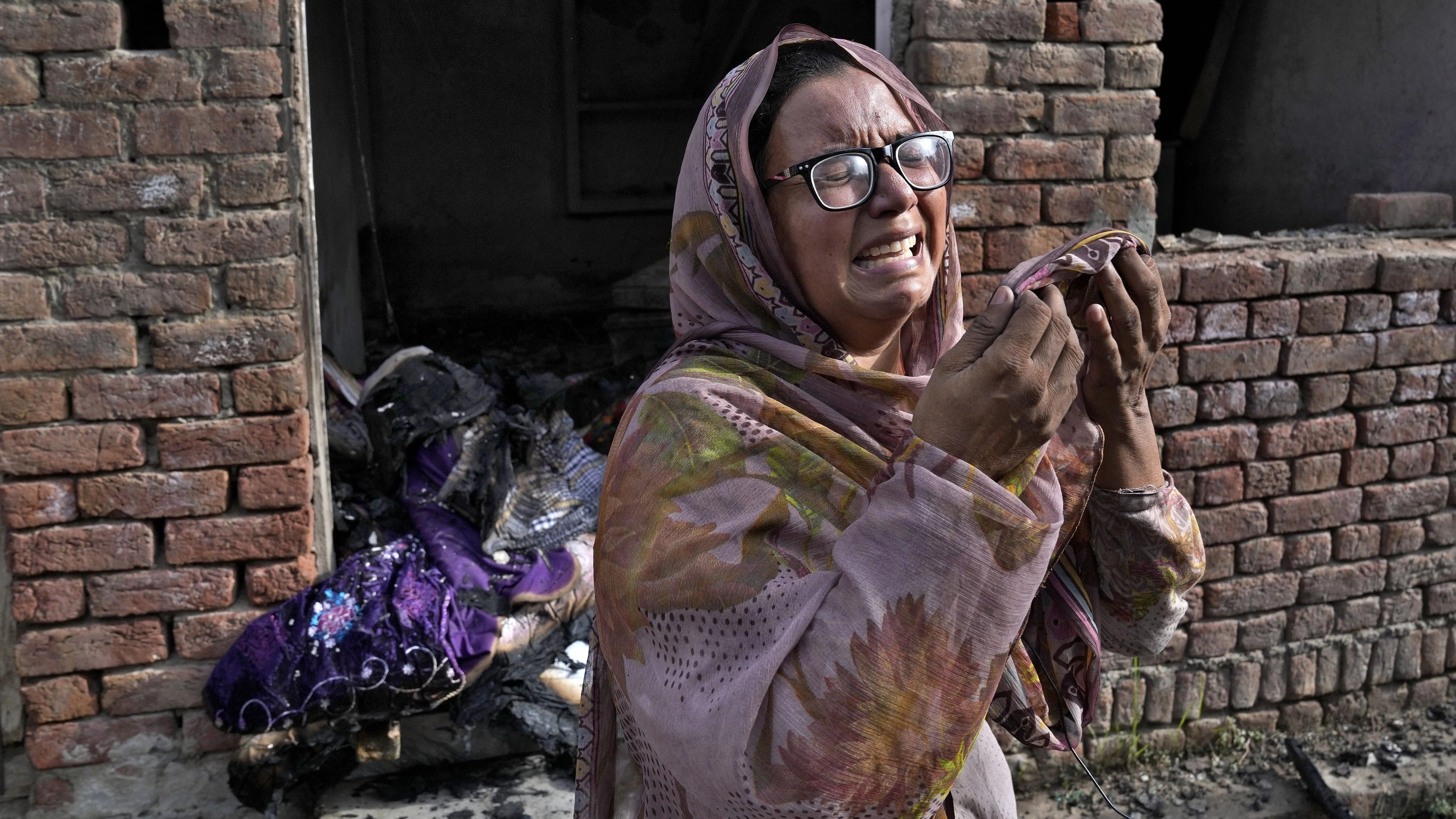 <div class="paragraphs"><p>A Christian woman weeps after looking at her home vandalized by an angry Muslim mob in Jaranwala in the Faisalabad district, Pakistan, Thursday, Aug. 17, 2023. Police arrested more than 100 Muslims in overnight raids from an area in eastern Pakistan where a Muslim mob angered over the alleged desecration of the Quran by a Christian man attacked churches and homes of minority Christians, prompting authorities to summon troops to restore order, officials said Thursday.</p></div>