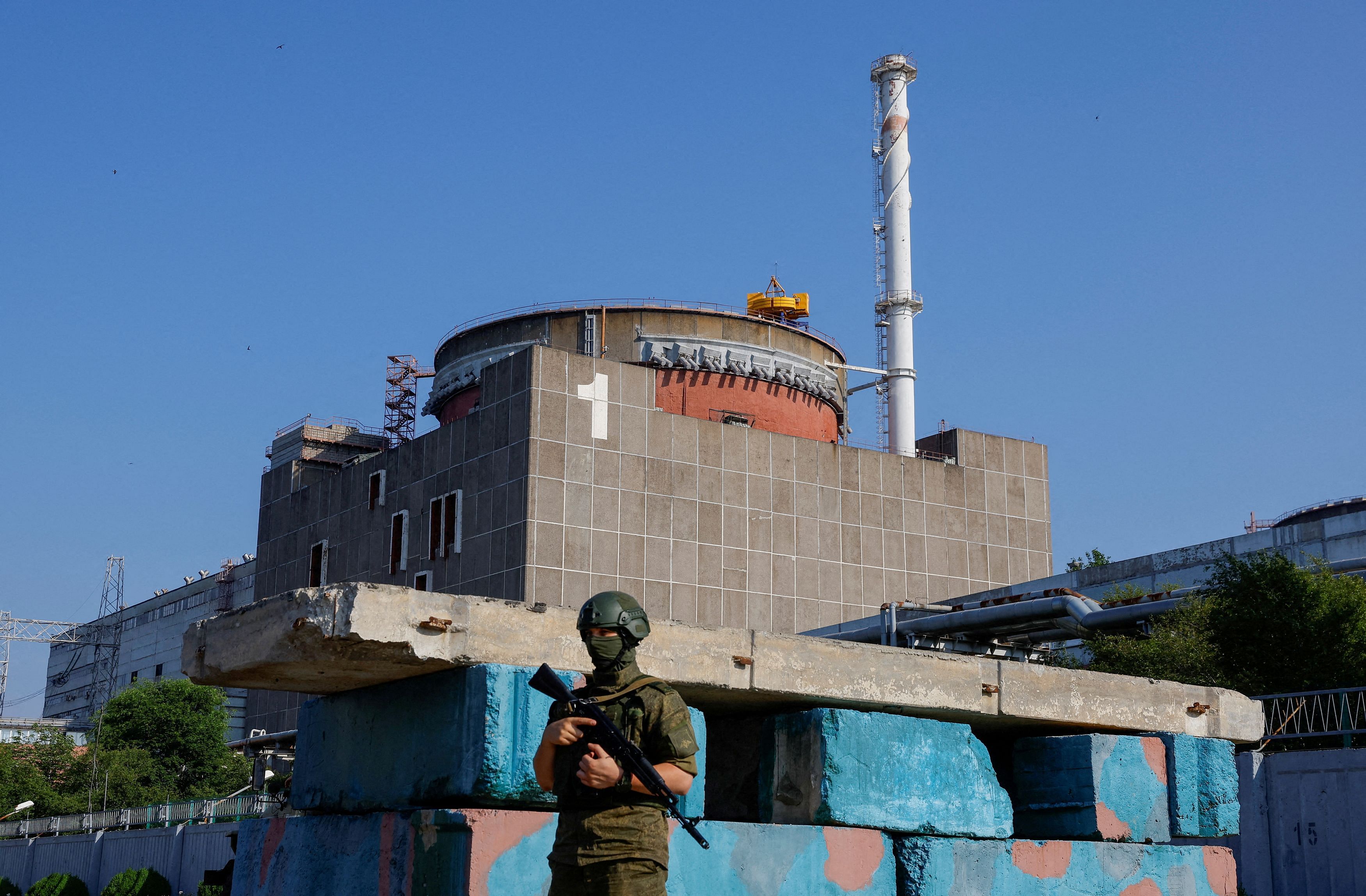 <div class="paragraphs"><p>A Russian service member stands guard at a checkpoint near the Zaporizhzhia Nuclear Power Plant before the arrival of the International Atomic Energy Agency expert mission in the course of Russia-Ukraine conflict outside Enerhodar in the Zaporizhzhia region, Russian-controlled Ukraine, June 15, 2023. </p></div>