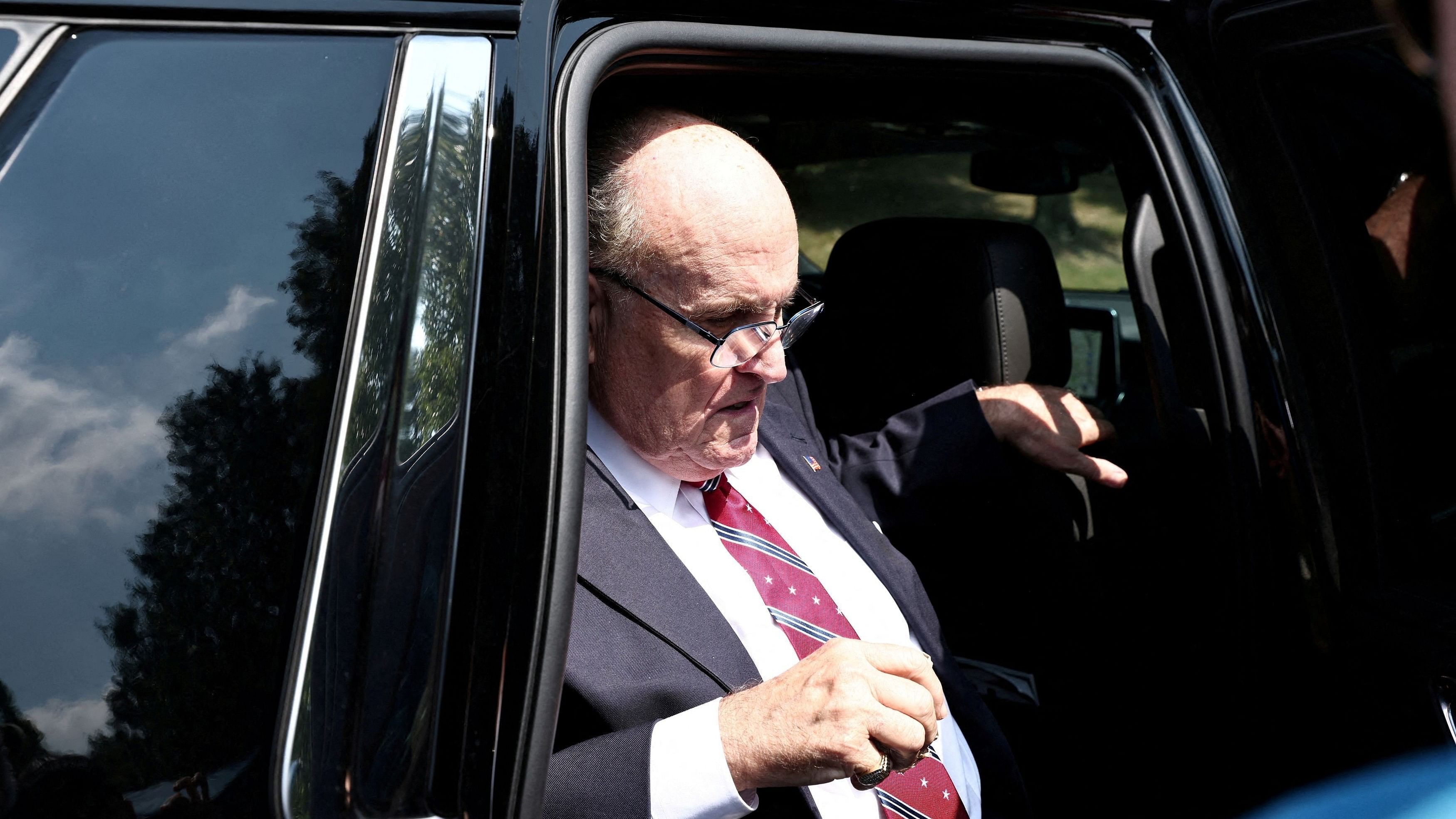 <div class="paragraphs"><p>Former New York City Mayor Rudy Giuliani gets out of his car to speak to reporters outside the Fulton County Jail after surrendering to face state charges arising from actions he is accused of taking to overturn former US President Donald Trump's 2020 election loss, in Atlanta, Georgia, US August 23, 2023. </p></div>
