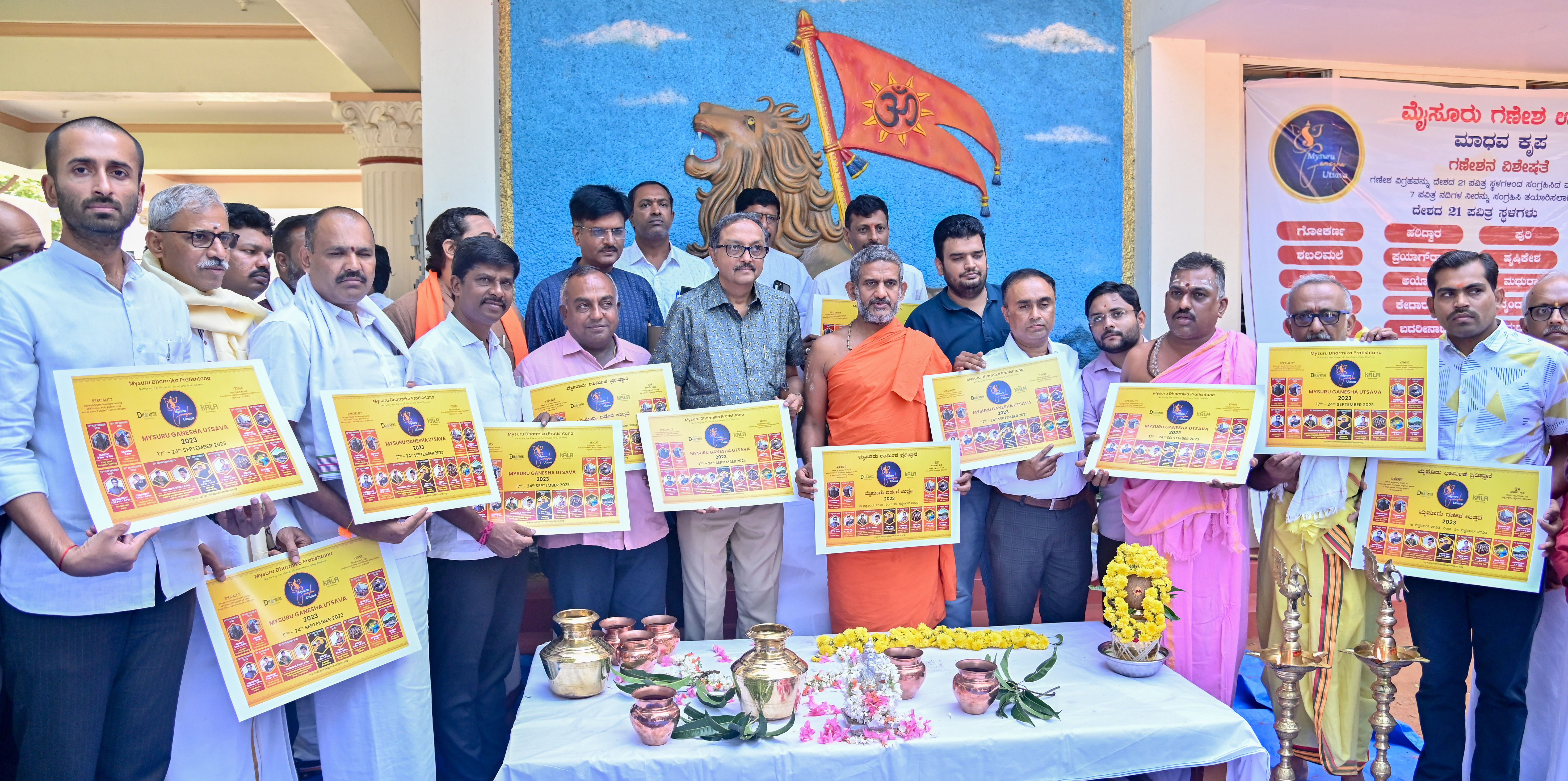 <div class="paragraphs"><p>Seer Vishwaprasanna Theertha Swami of Pejawar Mutt releases poster of Mysuru Ganesha Utsava 2023, organised by Mysuru Dharmika Prathistana, on Friday. BJP leader V Kaveesh Gowda, Mayor Shivakumar, MLA T S Srivathsa and educationist Vasudev Bhat are seen.<br></p></div>