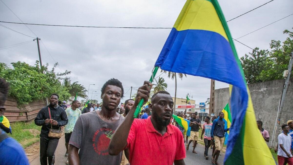 <div class="paragraphs"><p>People celebrate in support of the putschists in a street of Port-Gentil, Gabon.</p></div>