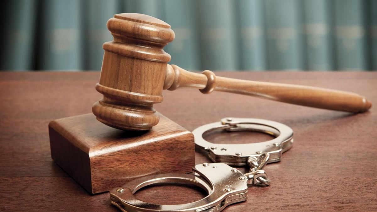 <div class="paragraphs"><p>Representative image of gavel and handcuffs.</p></div>