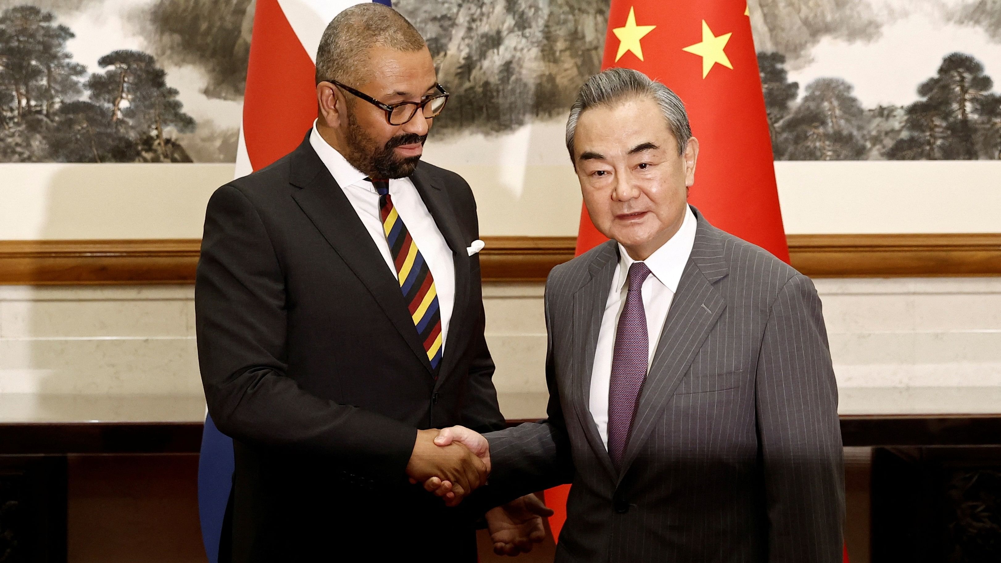 <div class="paragraphs"><p>British Foreign Secretary James Cleverly and Chinese Foreign Minister Wang Yi shake hands before a meeting at the Diaoyutai State Guesthouse in Beijing, China August 30, 2023.</p></div>