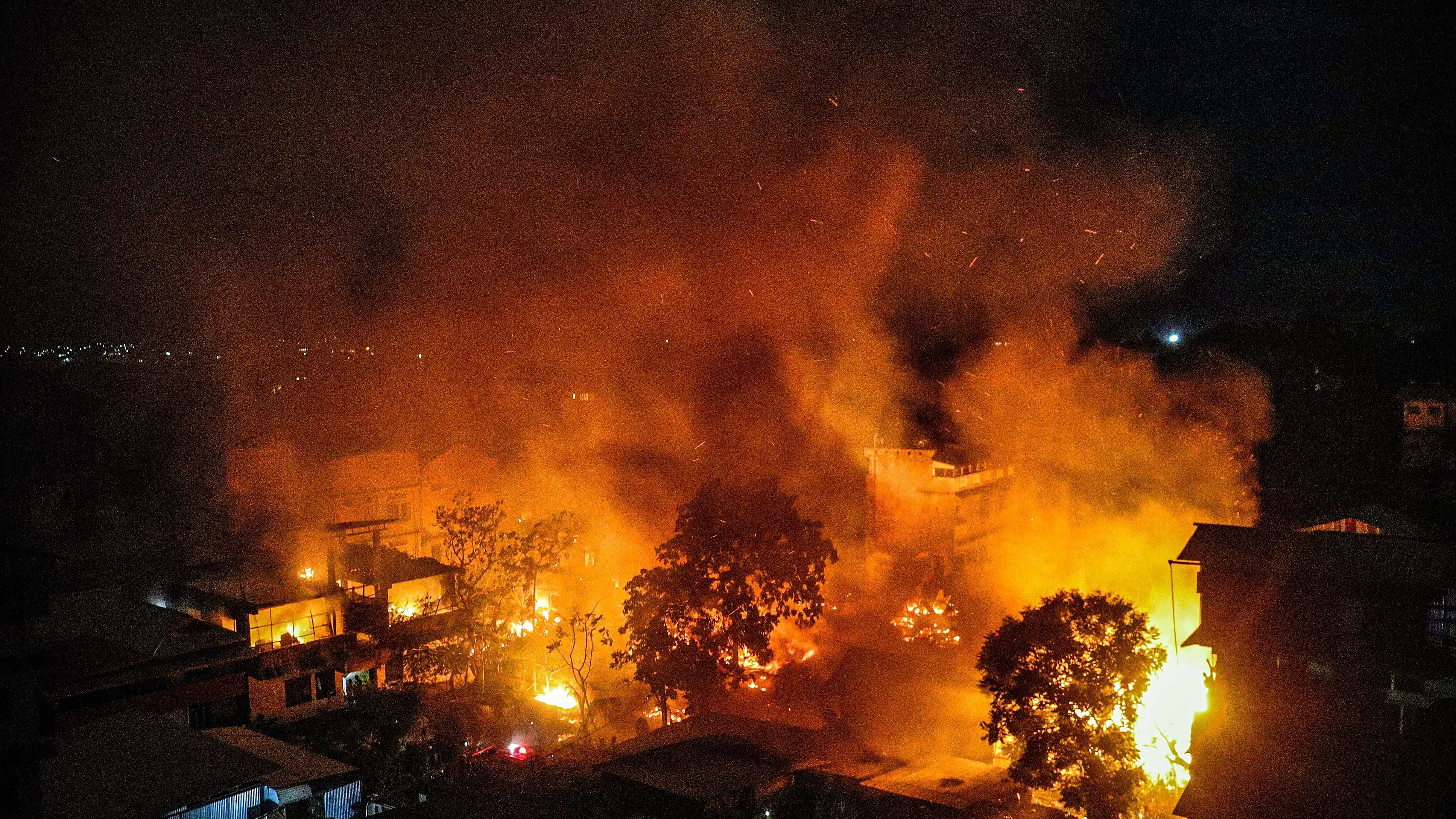 <div class="paragraphs"><p>Smoke and flame billows out after houses were set on fire by miscreants in Imphal on Tuesday. </p></div>