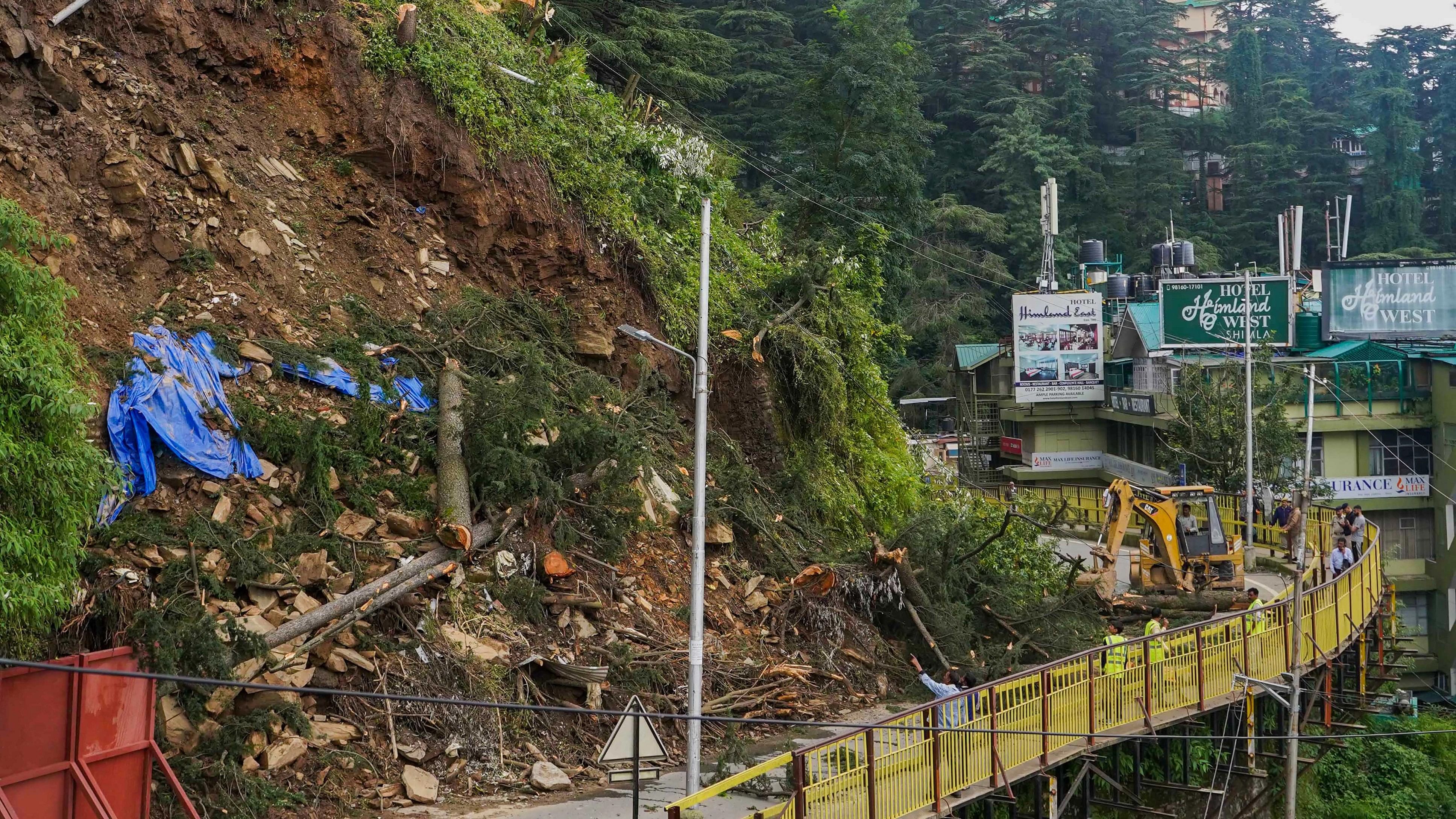 <div class="paragraphs"><p>Heavy machinery being used to remove trees from the Cart Road following recent monsoon rains, in Shimla, Saturday, Aug 19, 2023.</p></div>