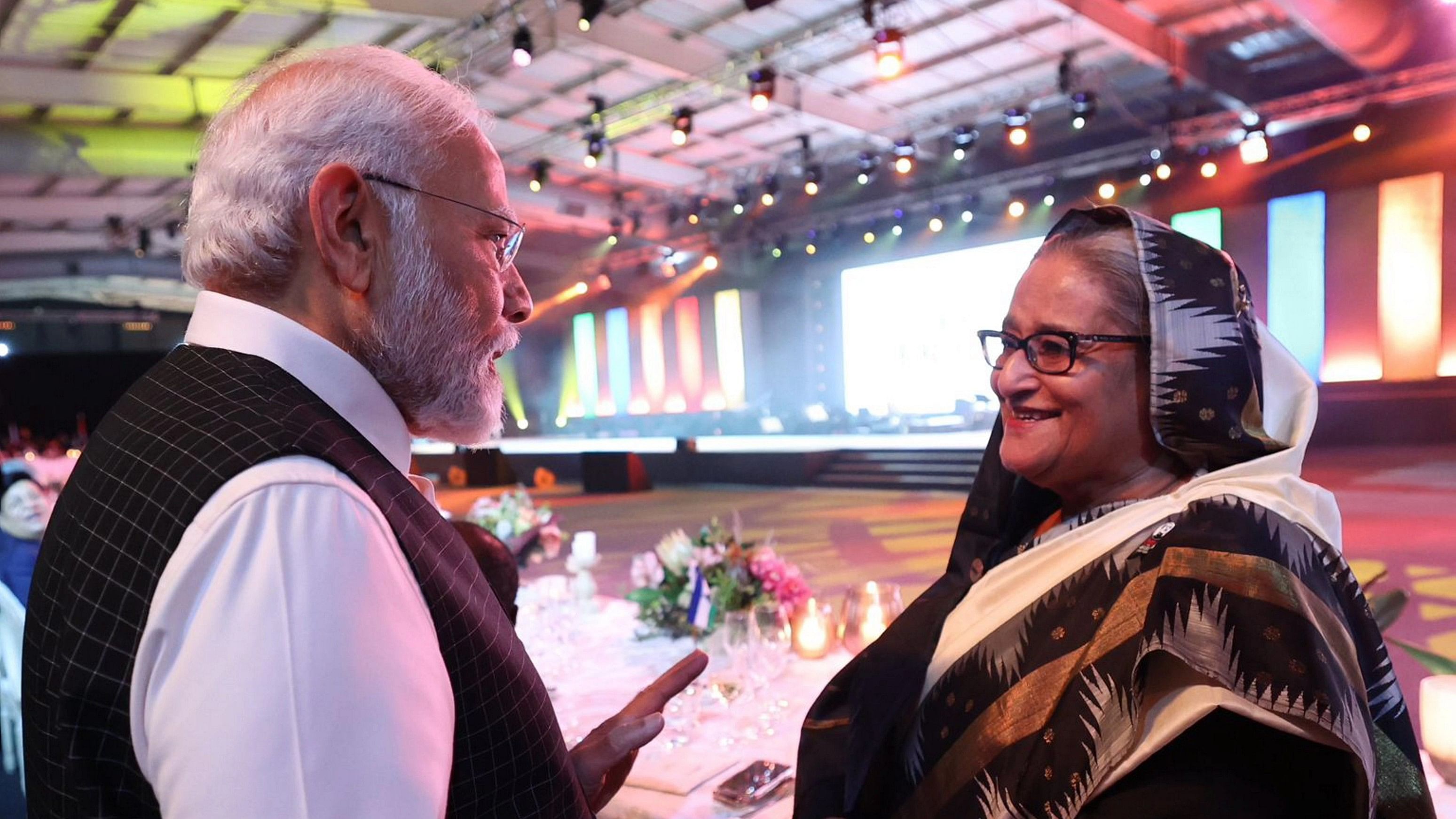 <div class="paragraphs"><p>Prime Minister Narendra Modi meets Bangladesh Prime Minister Sheikh Hasina at the banquet dinner during the BRICS Summit, in Johannesburg, South Africa.</p></div>