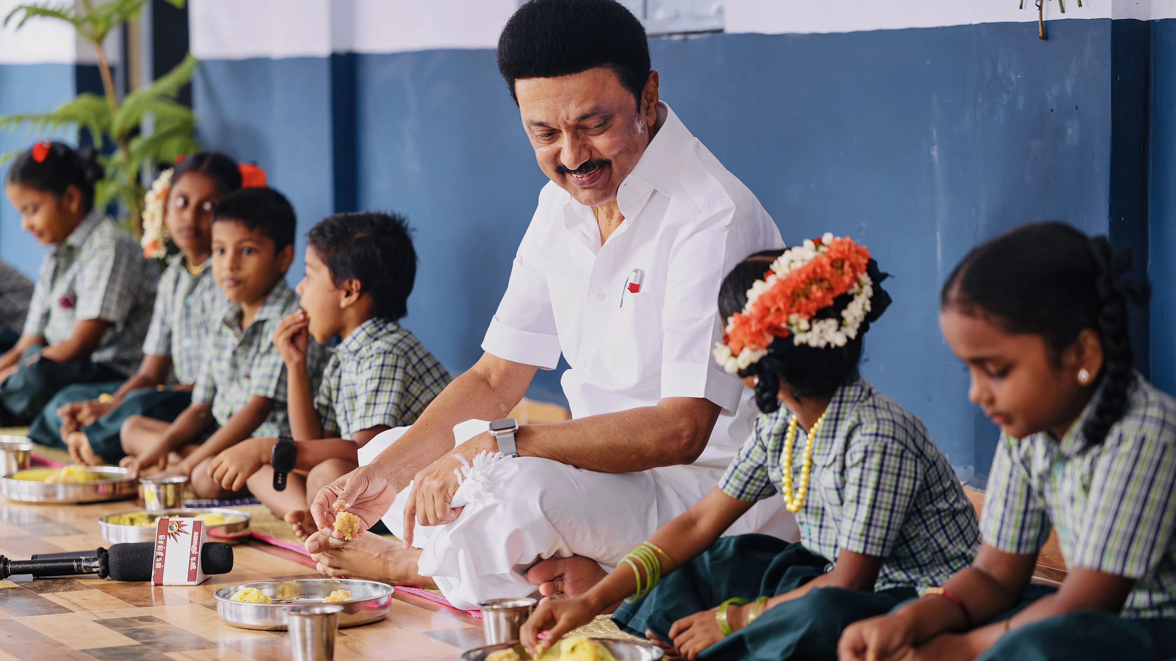 <div class="paragraphs"><p>Tamil Nadu Chief Minister MK Stalin dines students during the launch of the expansion of the state government's breakfast scheme for school children, at Tirukkuvali.</p></div>