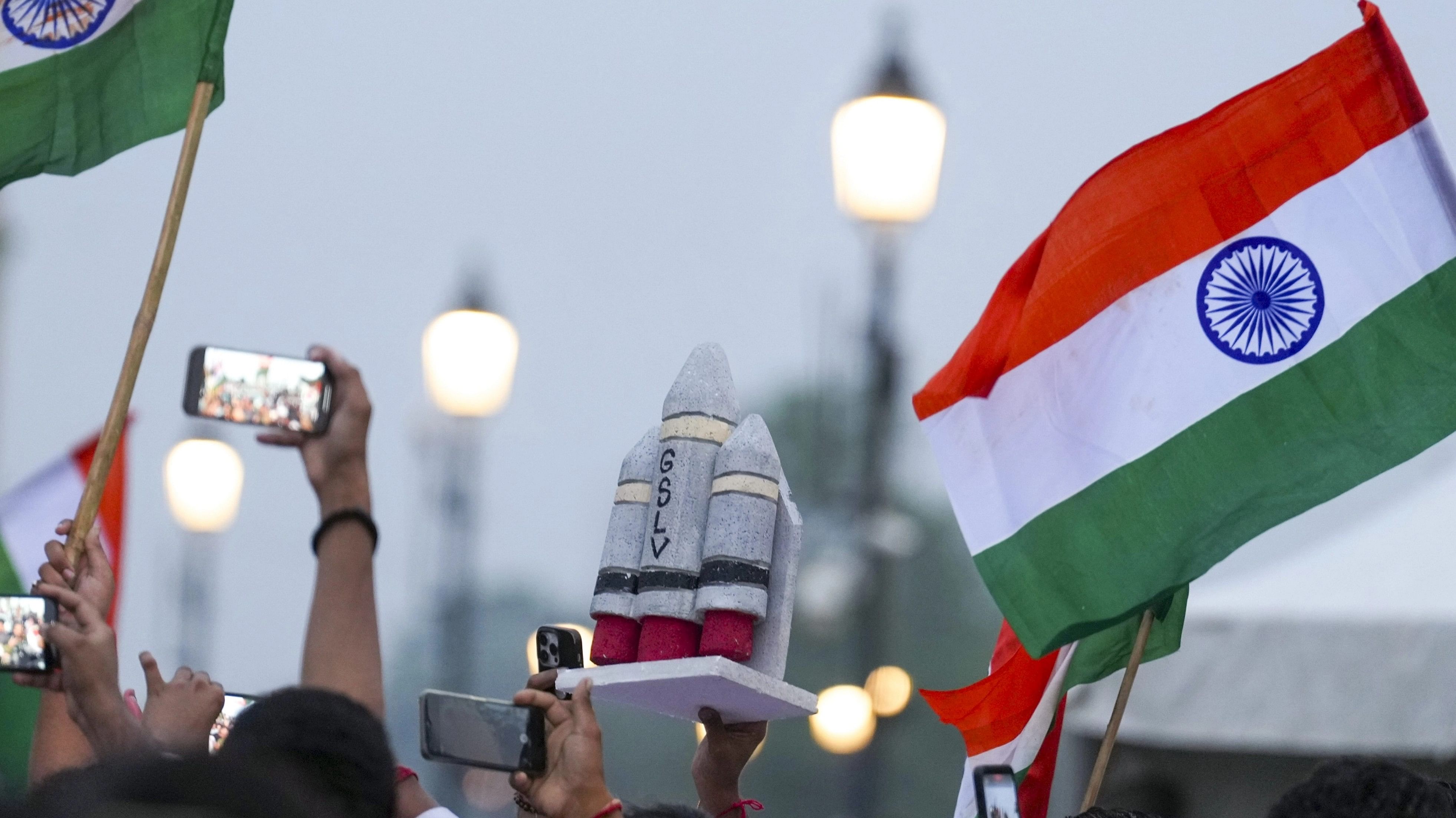 <div class="paragraphs"><p>New Delhi: People wave the Indian Tricolour during the celebration of the successful soft landing of ISRO's Chandrayaan-3 on the surface of the Moon, at the India Gate, in New Delhi, Friday, Aug. 23, 2023. </p></div>