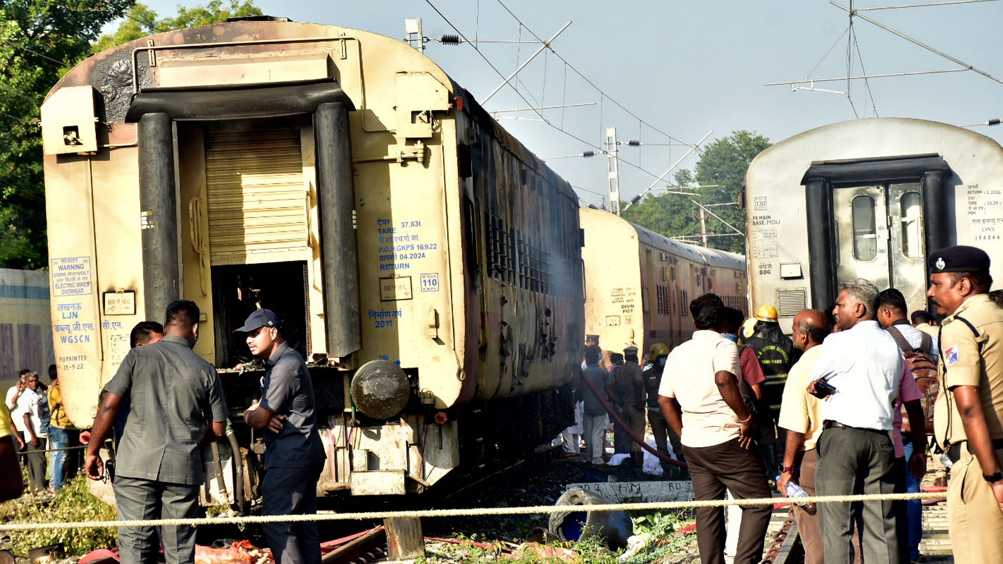 <div class="paragraphs"><p>Security personnel and other officials at the spot after a fire broke out in a coach of a train at Madurai railway station, Saturday, Aug. 26, 2023.</p></div>