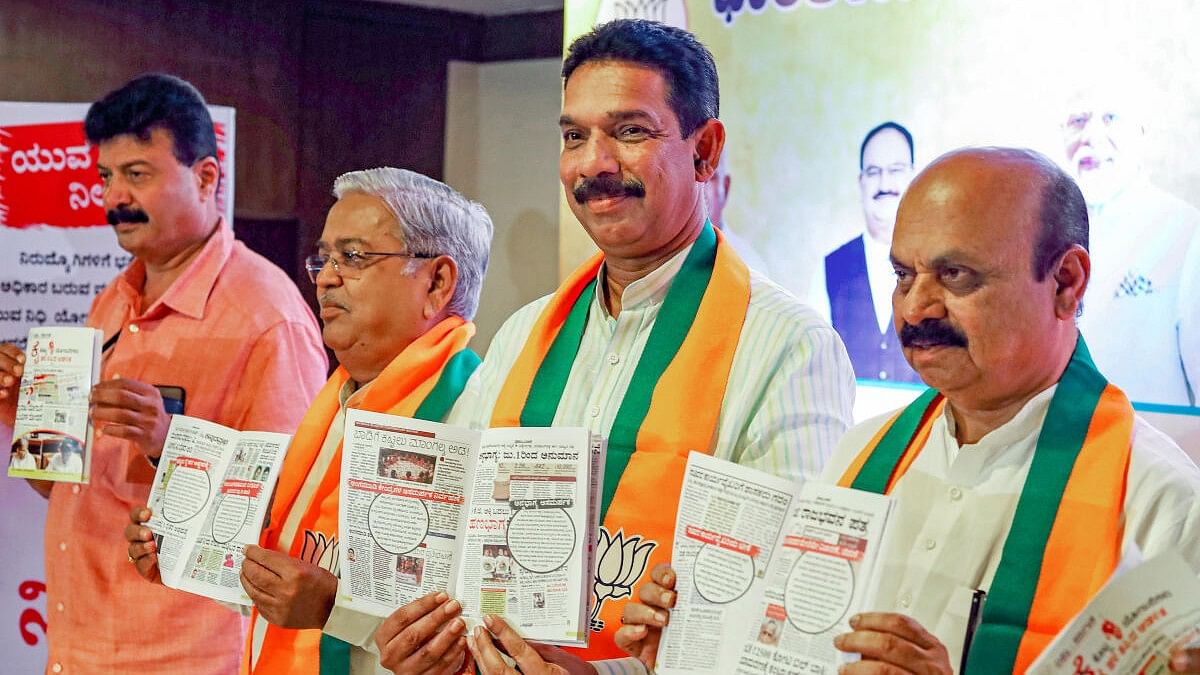 <div class="paragraphs"><p>Former Karnataka Chief Minister Basavaraj Bommai, state's BJP President Nalinkumar Katil and fomer minister Govind Karjol release a book alleging failures of the Congress-led state government, during a press conference, in Bengaluru.</p></div>