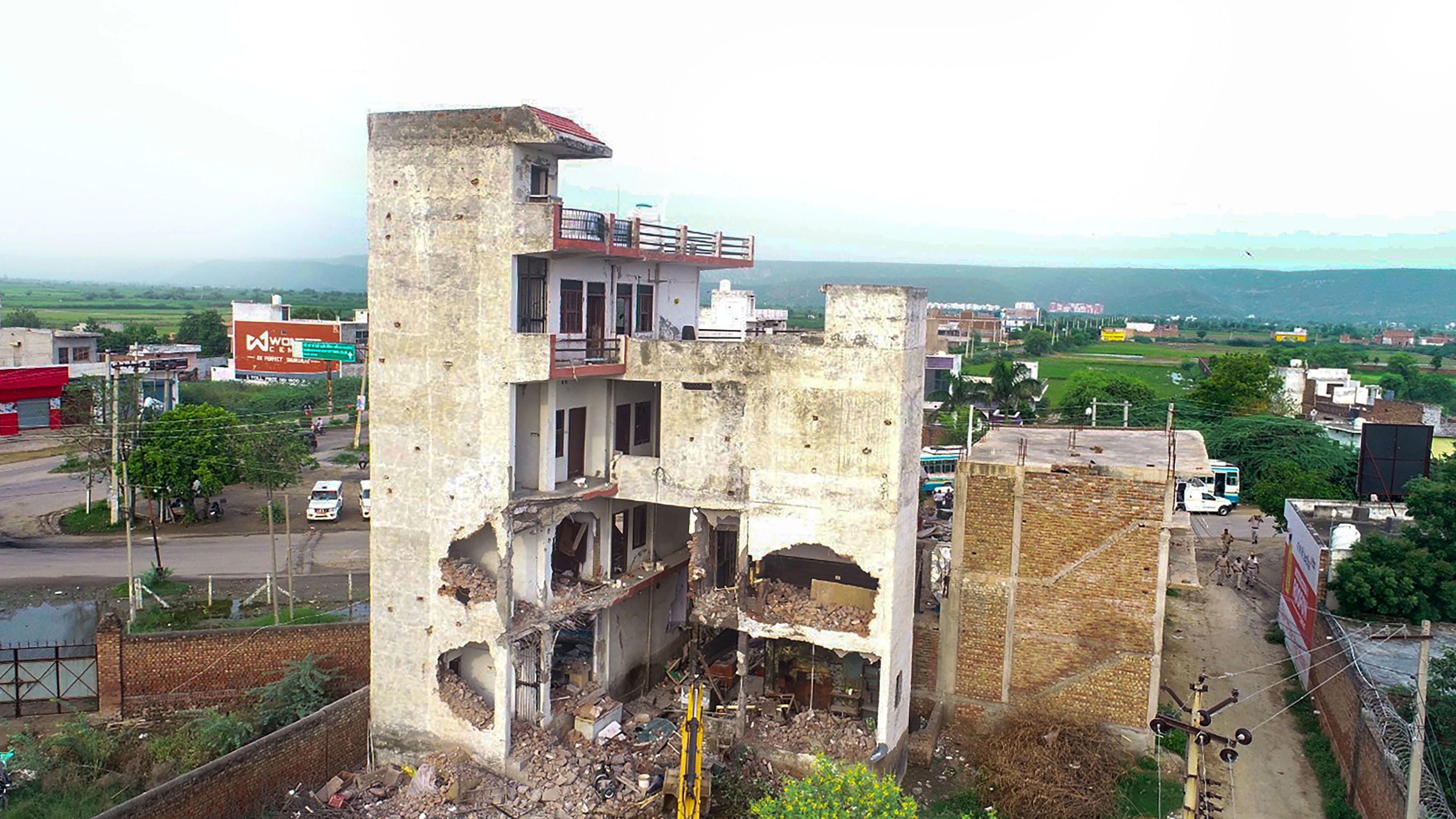 <div class="paragraphs"><p>Authorities demolish the Sahara Family restaurant from where hooligans allegedly pelted stones on a religious procession on July 31 which led to violence, in Nuh, Sunday, Aug 6, 2023. The building was demolished in administration's drive against illegal constructions. </p></div>