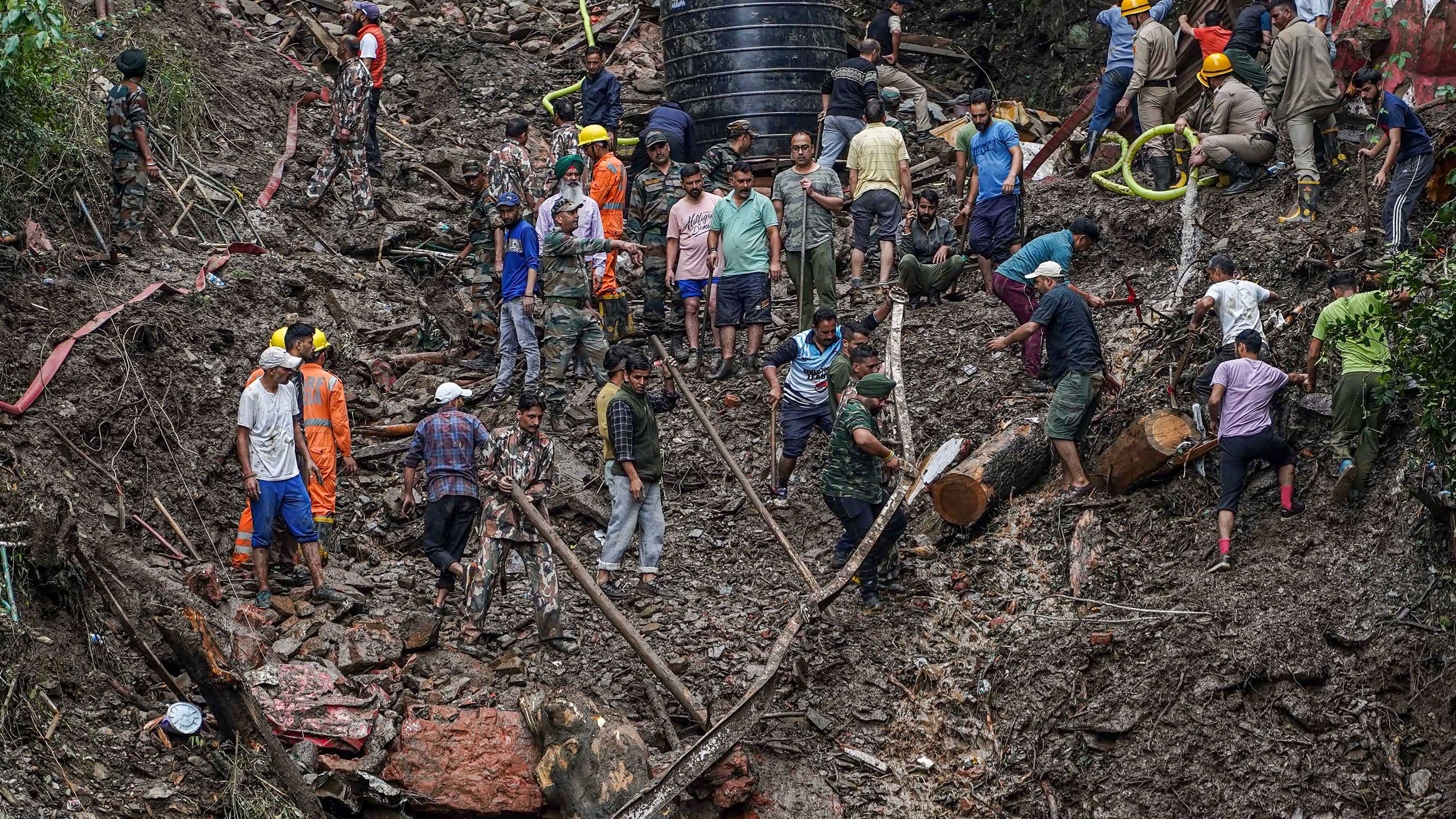 <div class="paragraphs"><p>NDRF personnel and locals during a search and rescue operation days after a landslide due to torrential rain, in Shimla.</p></div>