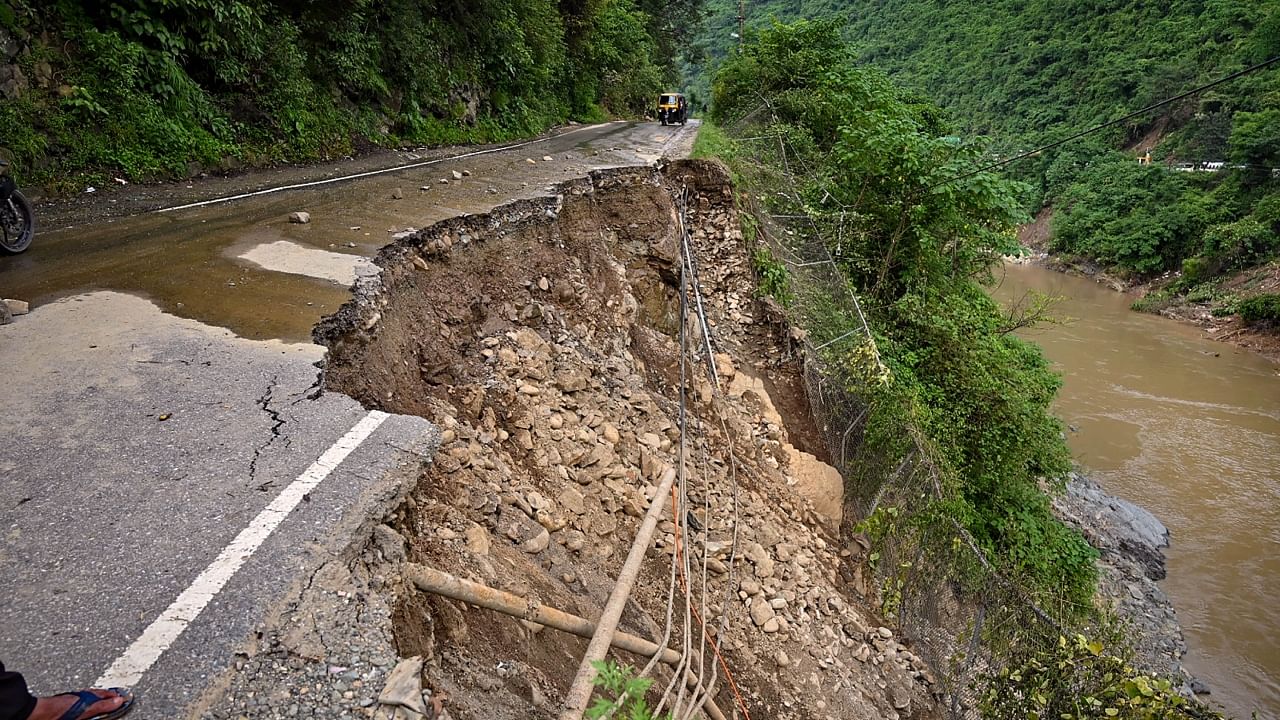 <div class="paragraphs"><p>A section of the Chandigarh-Manali highway is seen damaged after a landslide, near Mandi.</p></div>