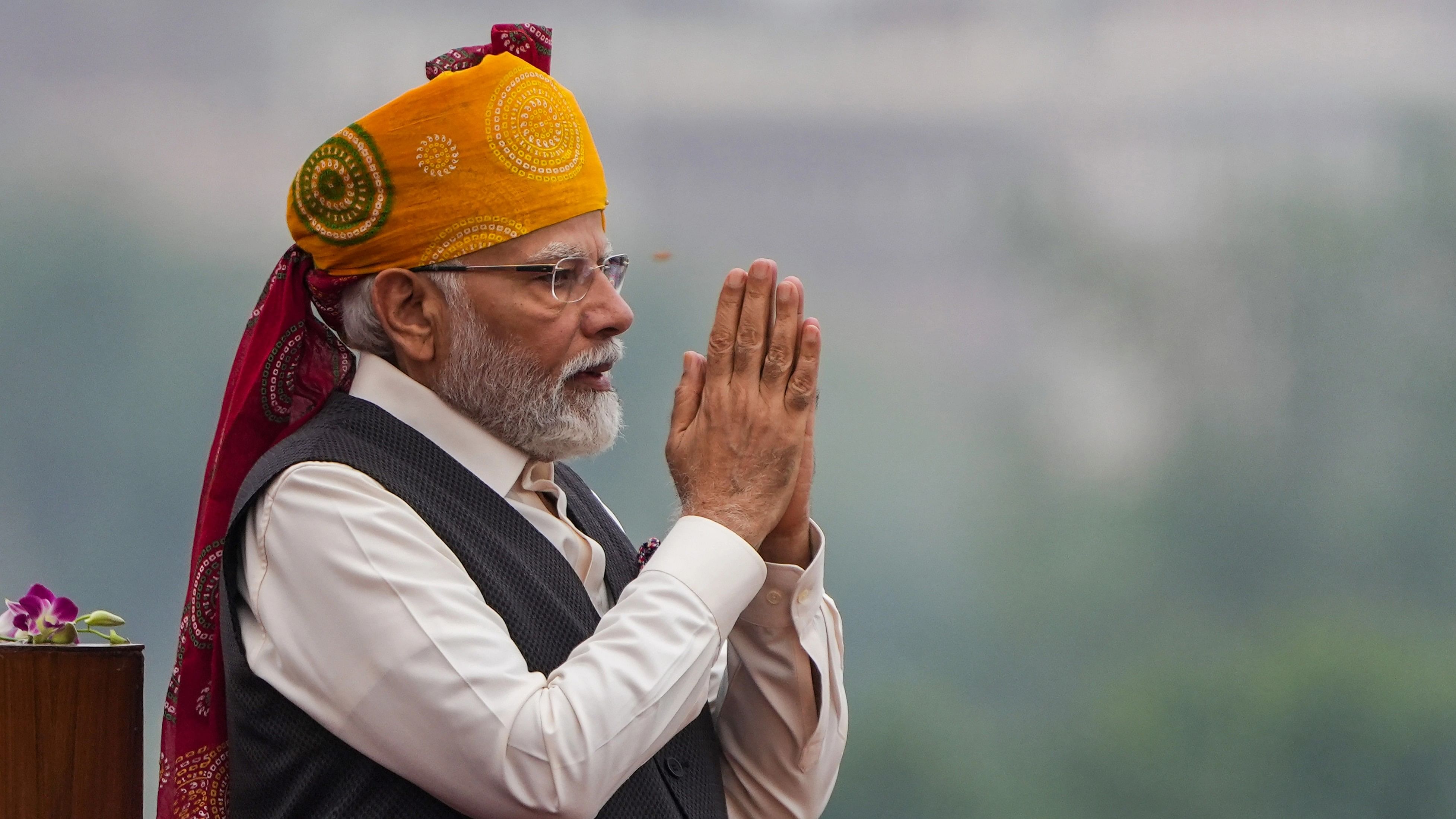 <div class="paragraphs"><p>Prime Minister Narendra Modi greets as he arrives to address the nation from the Red Fort on the occasion of the 77th Independence Day, in New Delhi, Tuesday, August 15, 2023. </p></div>