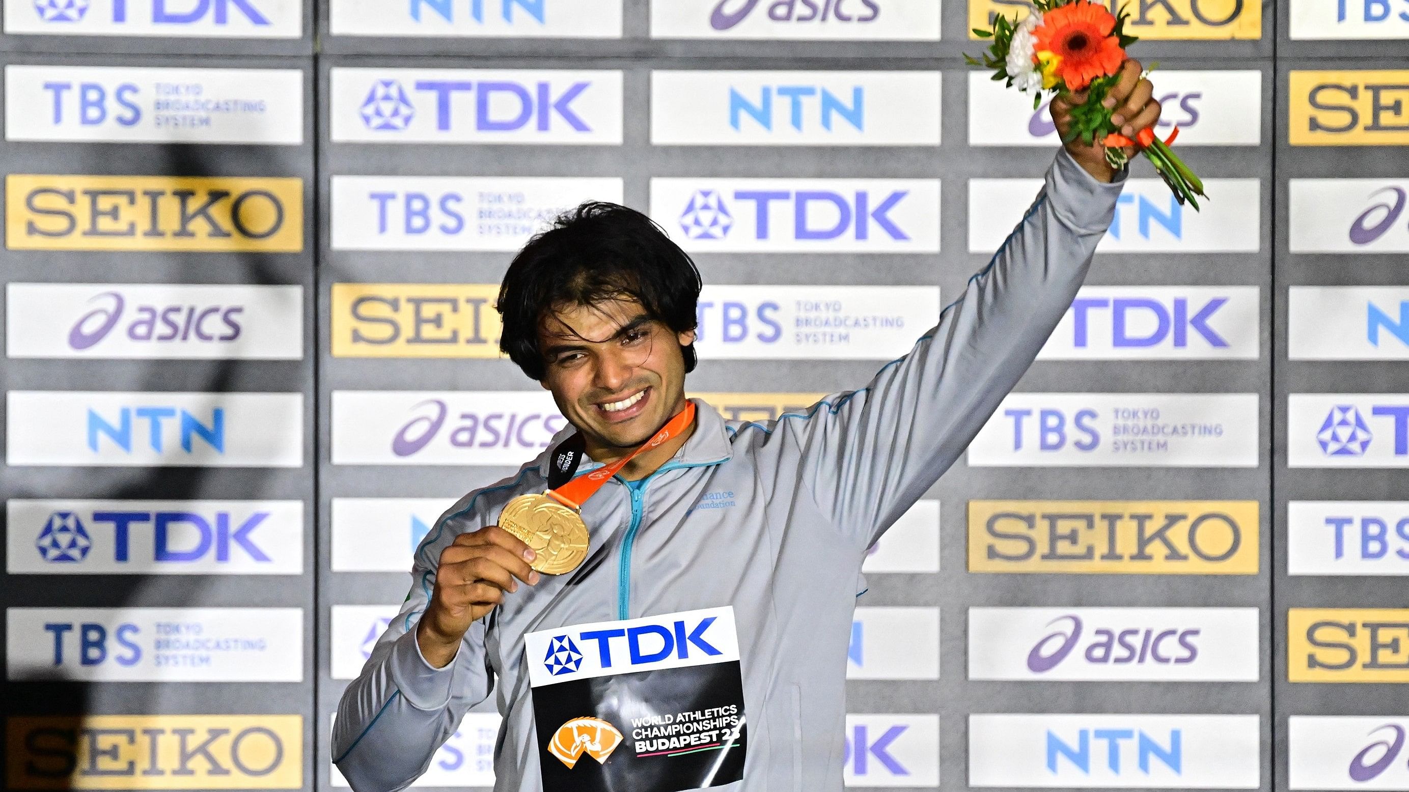 <div class="paragraphs"><p>India's Neeraj Chopra celebrates on the podium with his medal after winning the final of the&nbsp;World Athletics Championship. </p></div>