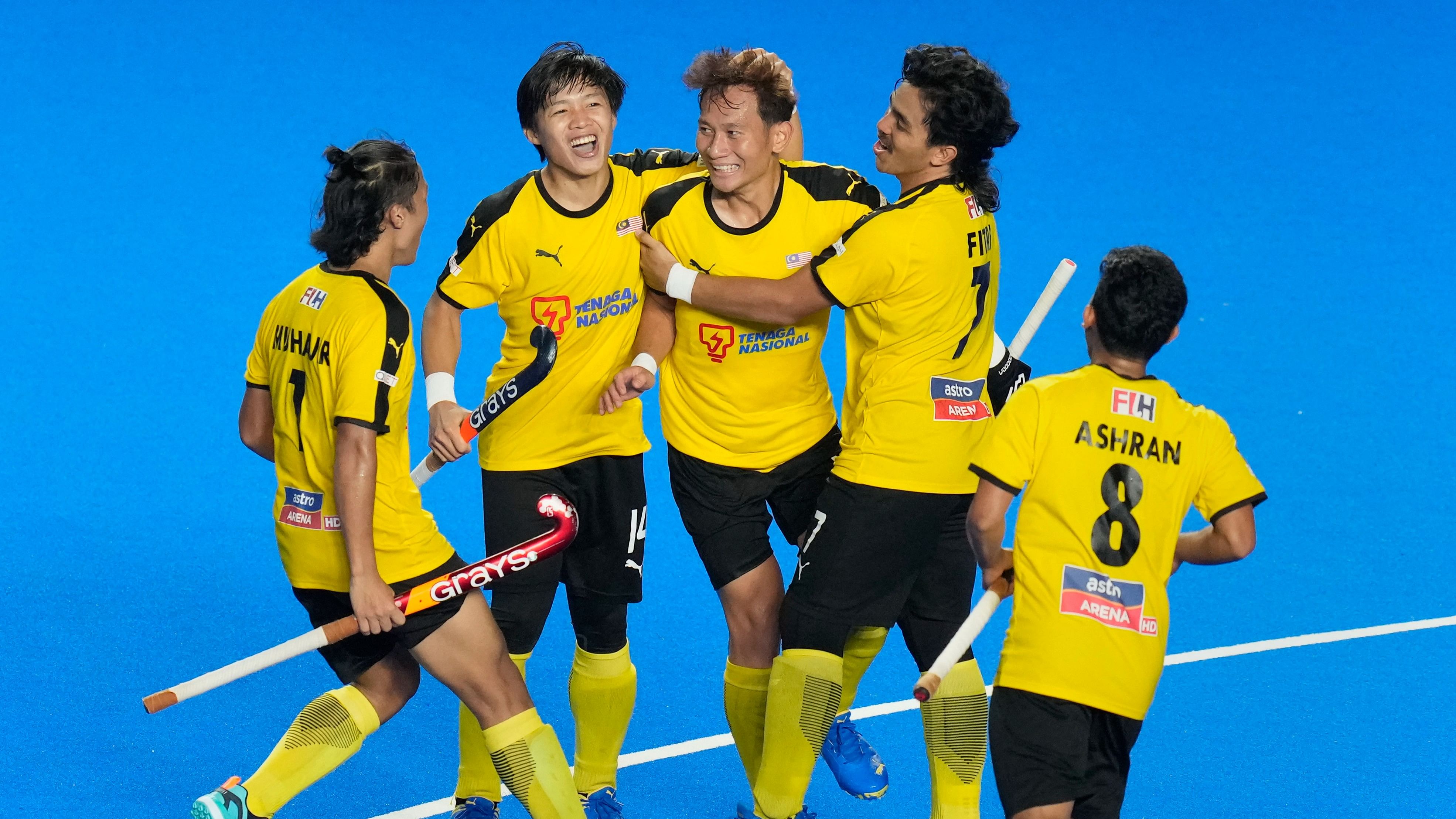 <div class="paragraphs"><p>Malaysia's Silverius Shello celebrates with teammates after scoring a goal during the first semi-final of Asian Champions Trophy 2023 hockey match between Malaysia and Korea, at Mayor Radhakrishnan Hockey Stadium, in Chennai.</p></div>