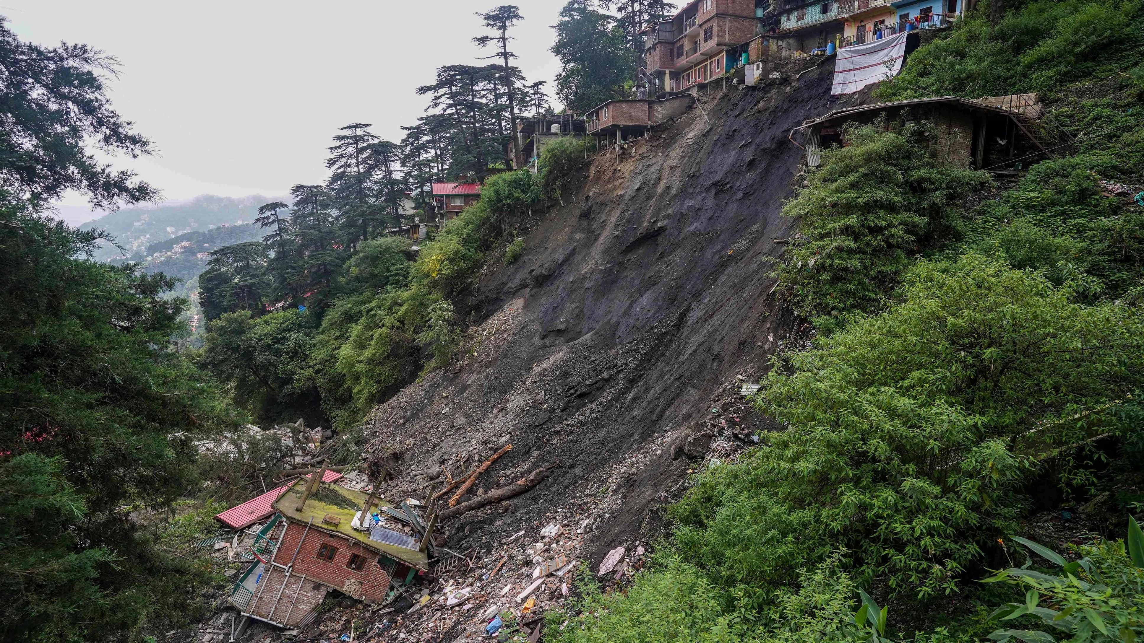 <div class="paragraphs"><p>A landslide affected area where several&nbsp;buildings were damaged after heavy rains, at Krishna Nagar ward in Shimla</p></div>