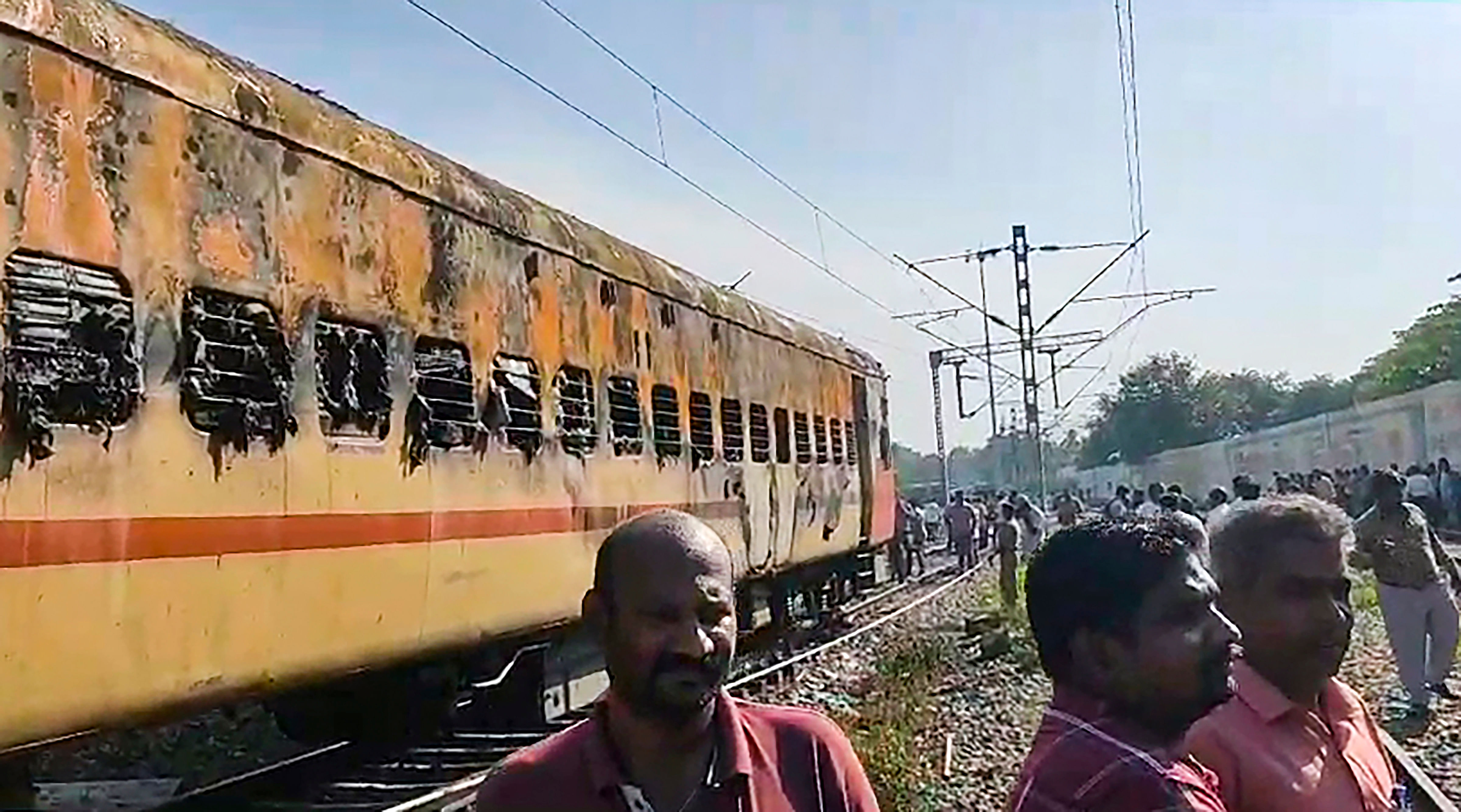 <div class="paragraphs"><p> Security personnel and other officials at the spot after a fire broke out in a coach of a train at Madurai railway station.</p></div>