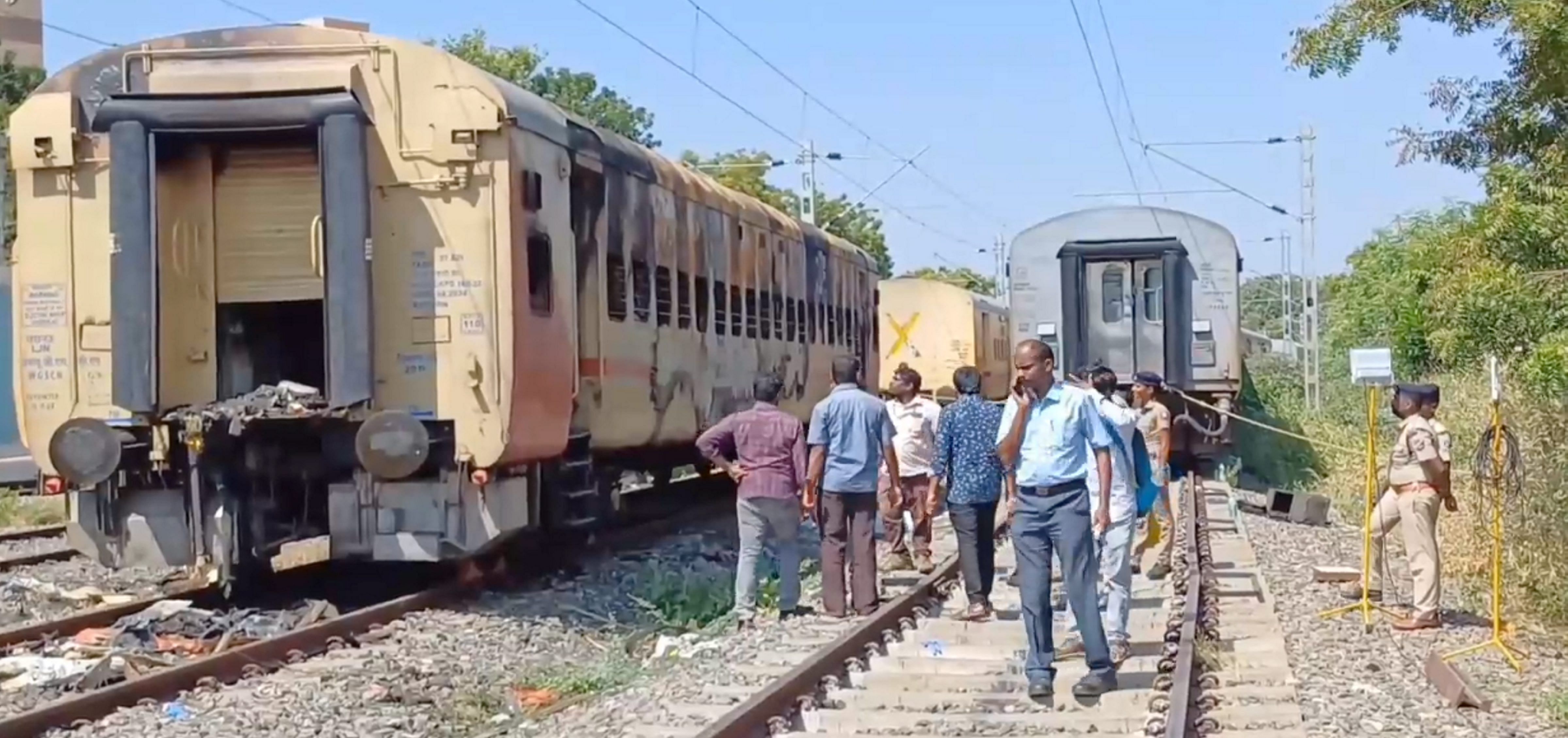 <div class="paragraphs"><p>Police personnel stand guard at the site of train fire accident where forensic experts are conducting an investigation for the second day, in <ins>Madurai</ins>, Sunday, Aug 27, 2023.</p></div>