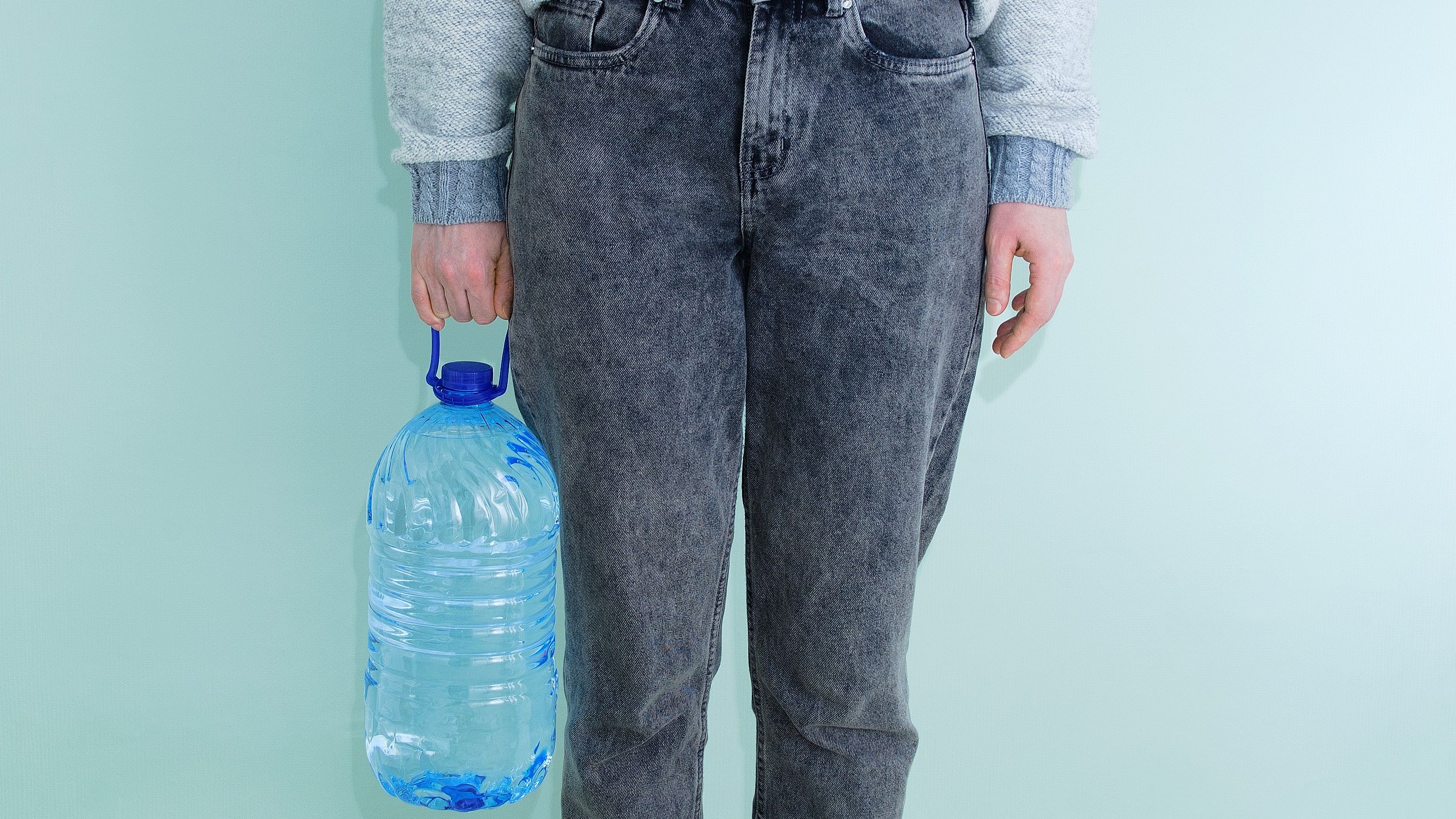 <div class="paragraphs"><p>Representative image showing a person carrying a large jar of water.</p></div>