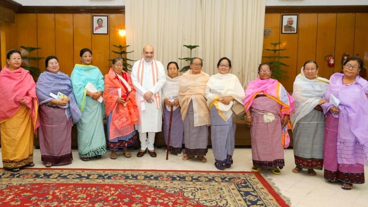 <div class="paragraphs"><p>Union Home Minister Amit Shah in a meeting with a group of women leaders (Meira Paibis) in Manipur. </p></div>
